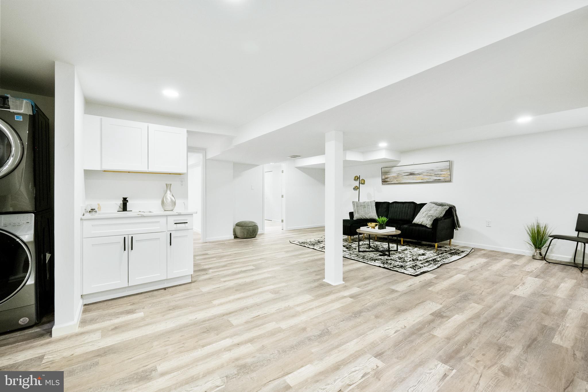 6907 Kipling Parkway District Heights, MD 20747 - Photo 25 of 39 a view of kitchen with sink microwave and cabinets