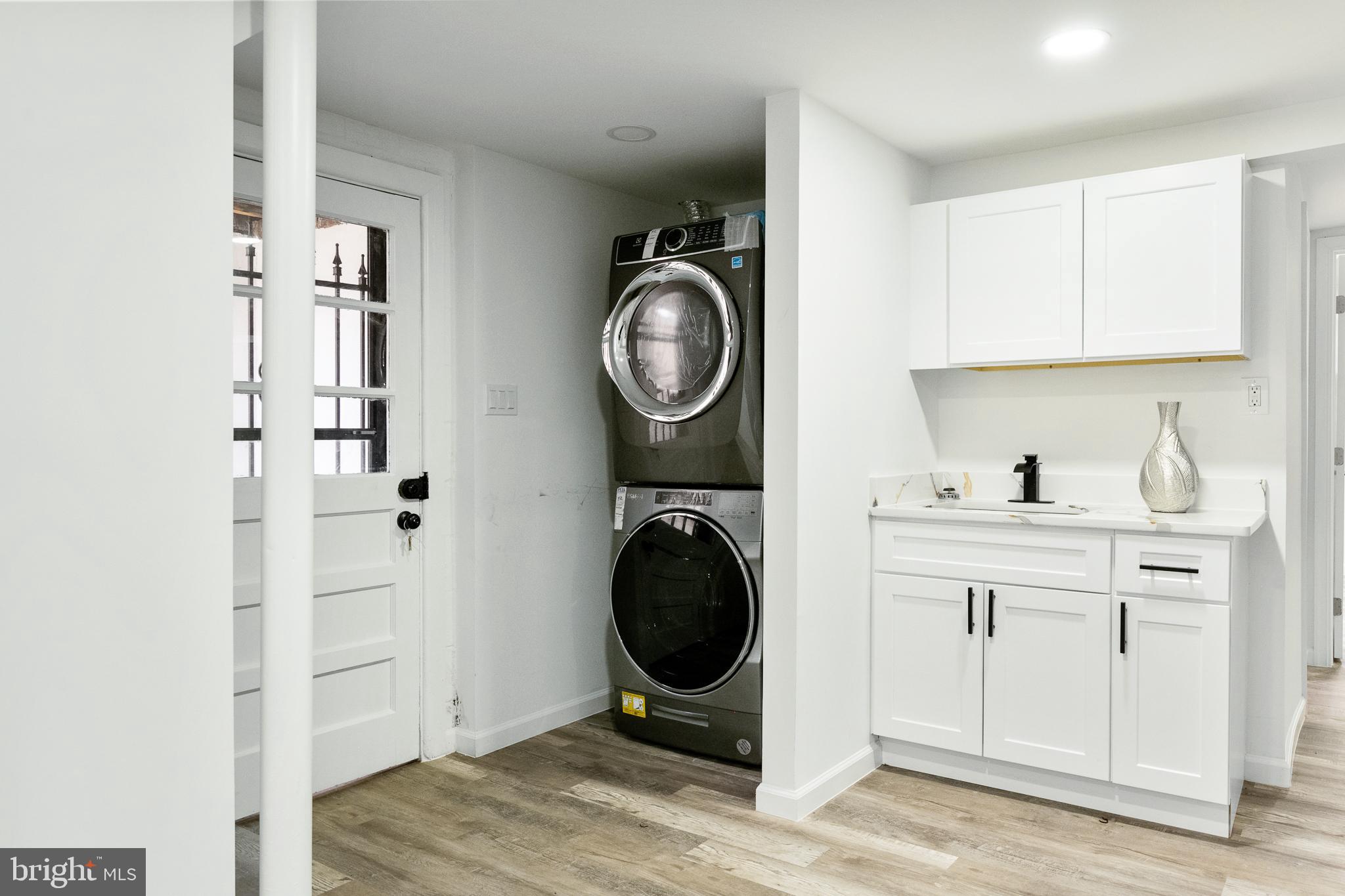 6907 Kipling Parkway District Heights, MD 20747 - Photo 26 of 39 a view of a kitchen with sink washer and dryer