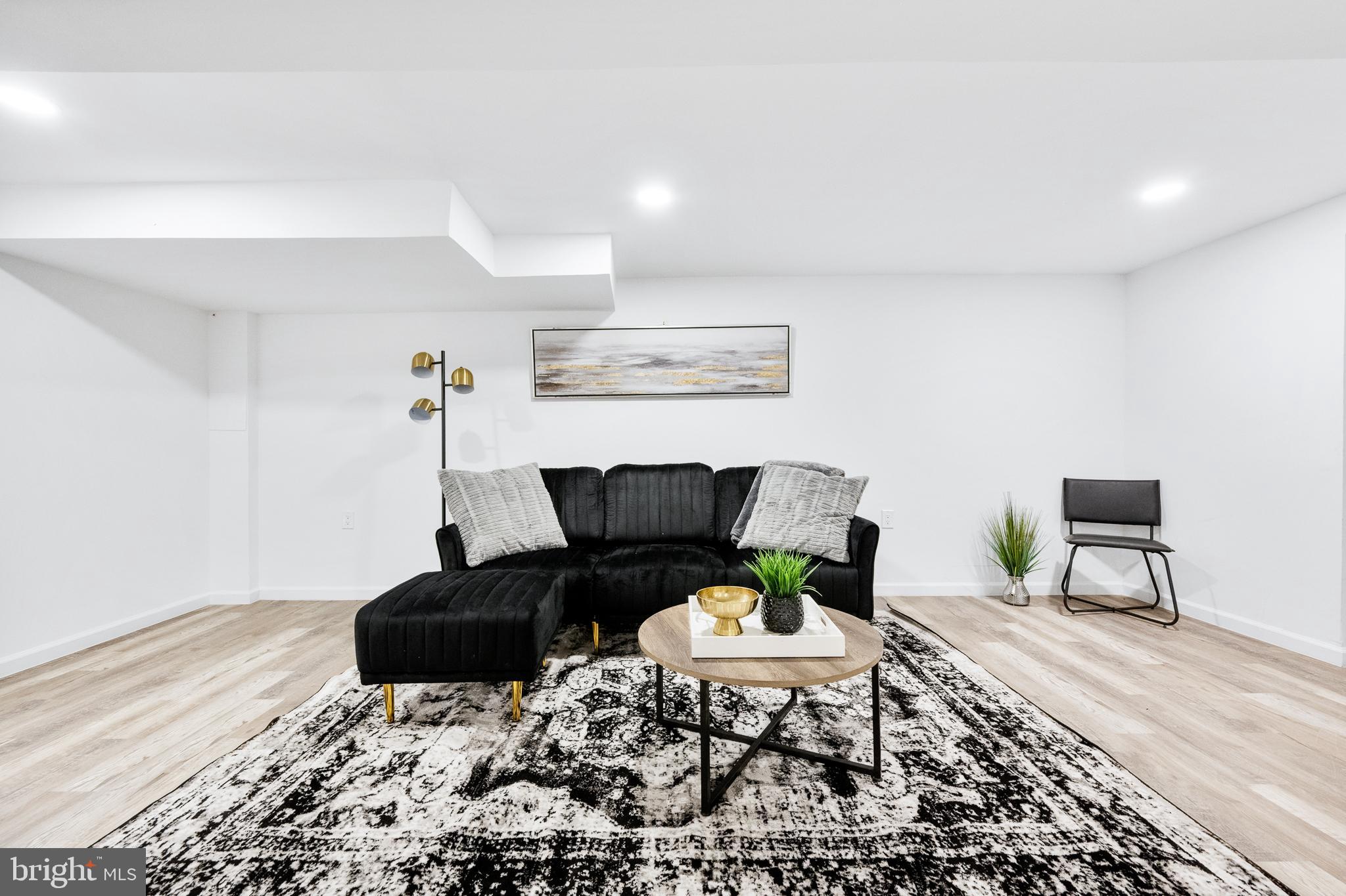 6907 Kipling Parkway District Heights, MD 20747 - Photo 27 of 39 a living room with furniture and a rug