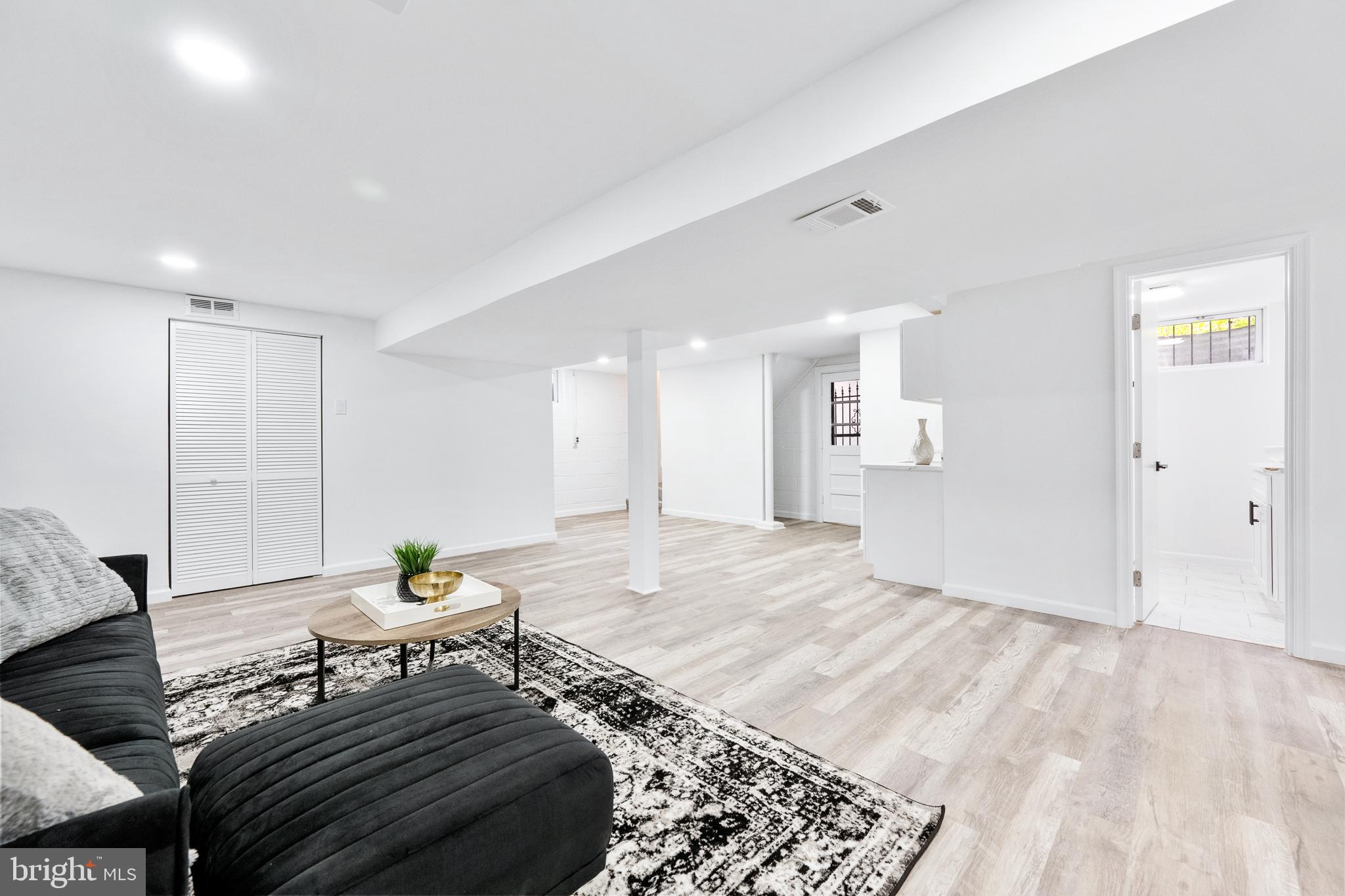 6907 Kipling Parkway District Heights, MD 20747 - Photo 28 of 39 a living room with furniture and wooden floor