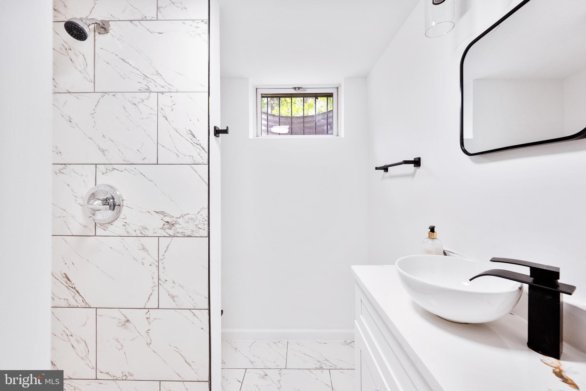 6907 Kipling Parkway District Heights, MD 20747 - Photo 30 of 39 a bathroom with a bathtub and a toilet