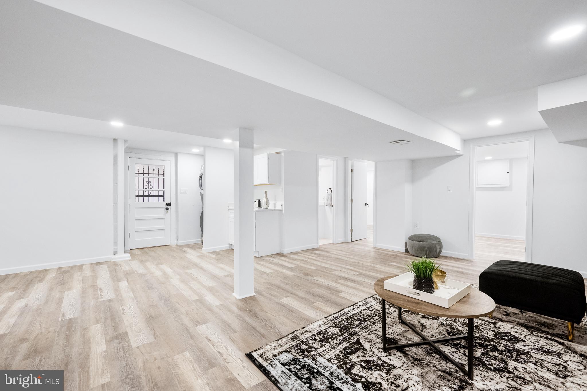 6907 Kipling Parkway District Heights, MD 20747 - Photo 35 of 39 a living room with furniture rug and a table