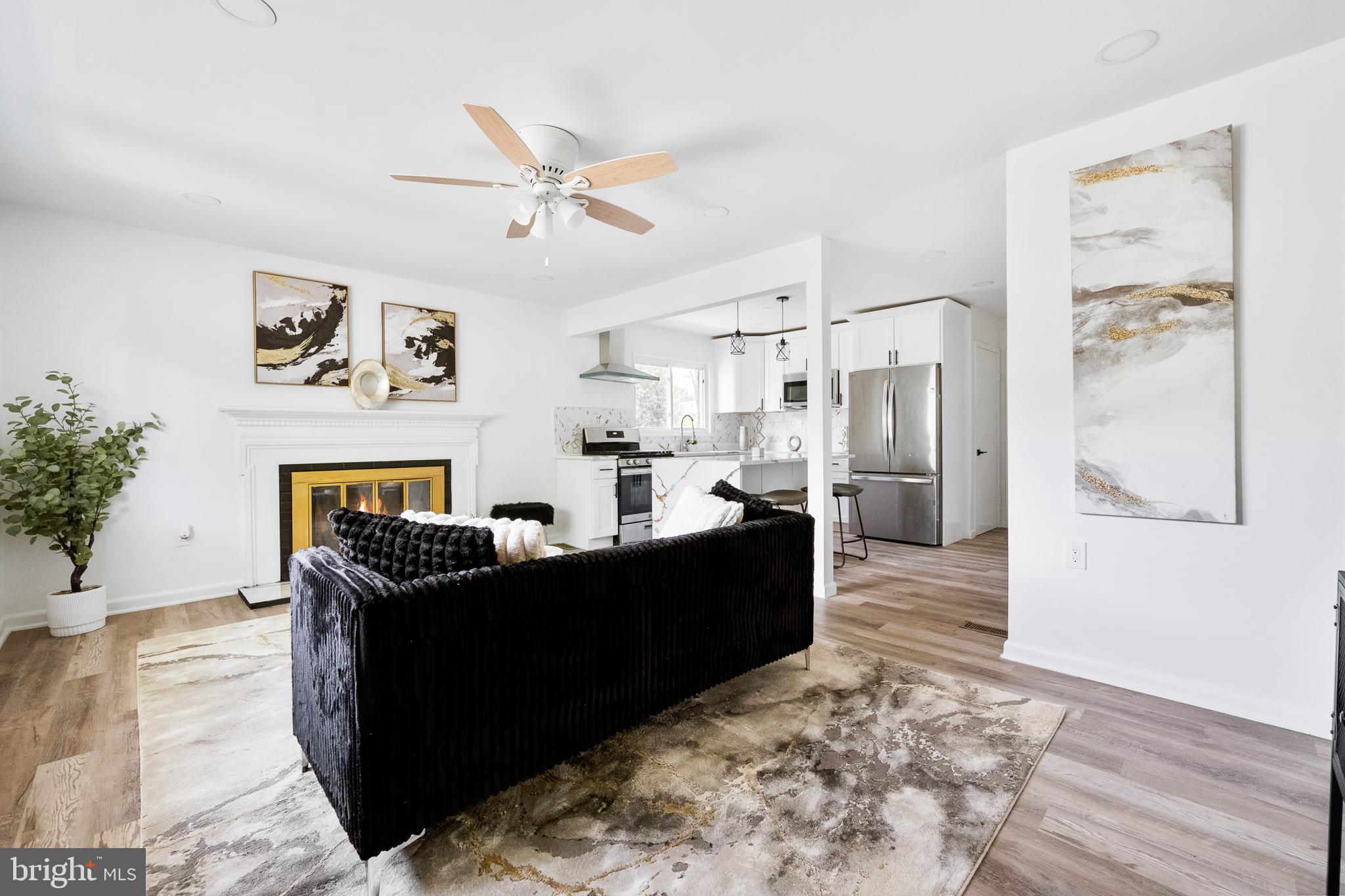 6907 Kipling Parkway District Heights, MD 20747 - Photo 5 of 39 a living room with furniture and a fireplace