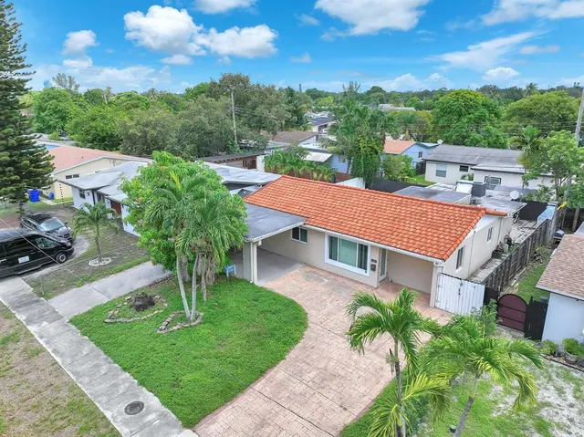 a aerial view of a house with a yard