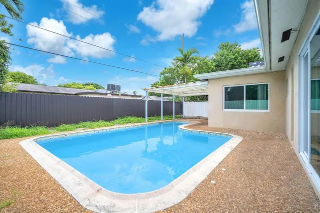 a view of outdoor space and swimming pool