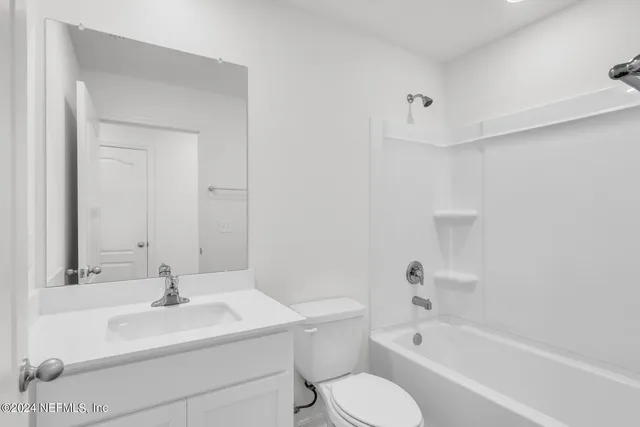 a bathroom with a sink toilet and bathtub