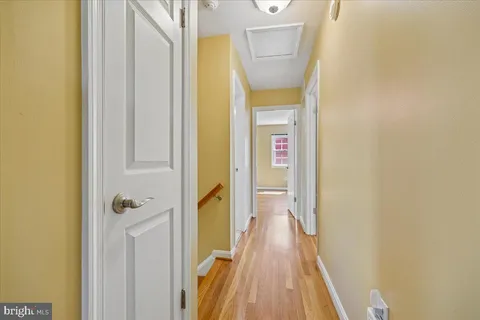 a bedroom with a bed and a book shelf