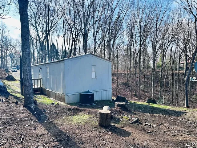 a backyard of a house with barbeque oven