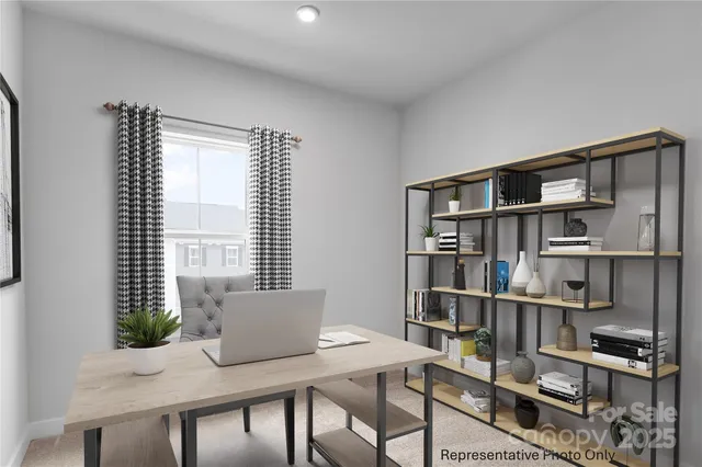 a view of a workspace with furniture and a bookshelf