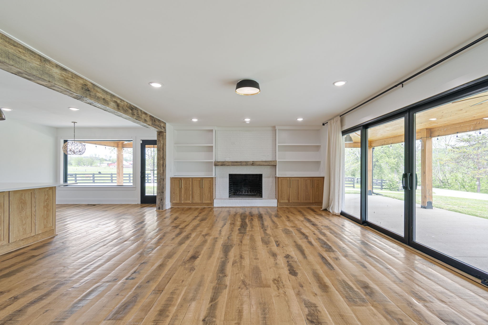 4824 Leipers Creek Road Williamsport, TN 38487 - Photo 11 of 34 a view of an empty room with wooden floor and a window