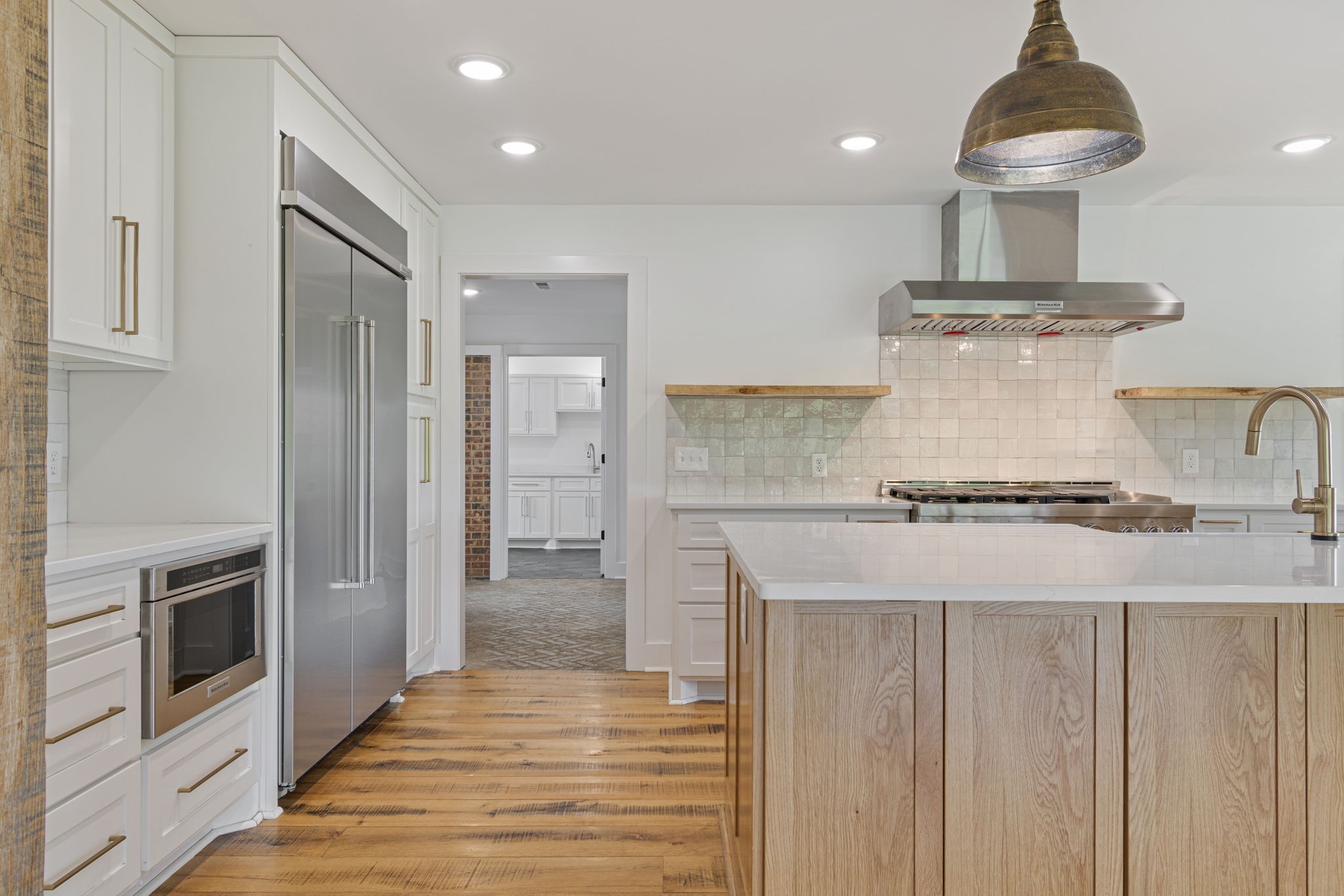 4824 Leipers Creek Road Williamsport, TN 38487 - Photo 7 of 34 a kitchen with stainless steel appliances granite countertop a stove and a refrigerator