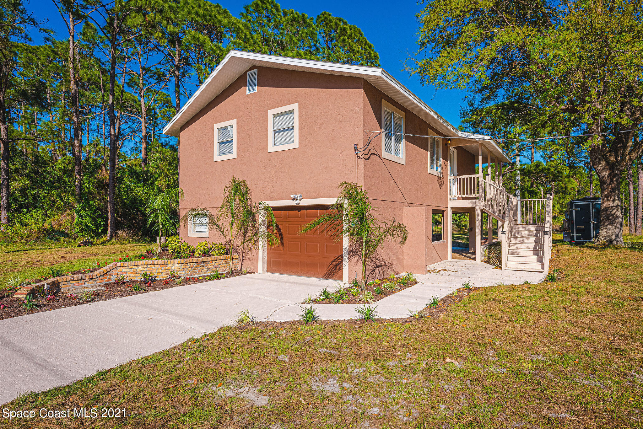 765 Garvey Road Palm Bay, FL 32908 - Photo 1 of 81 a view of a house with a yard