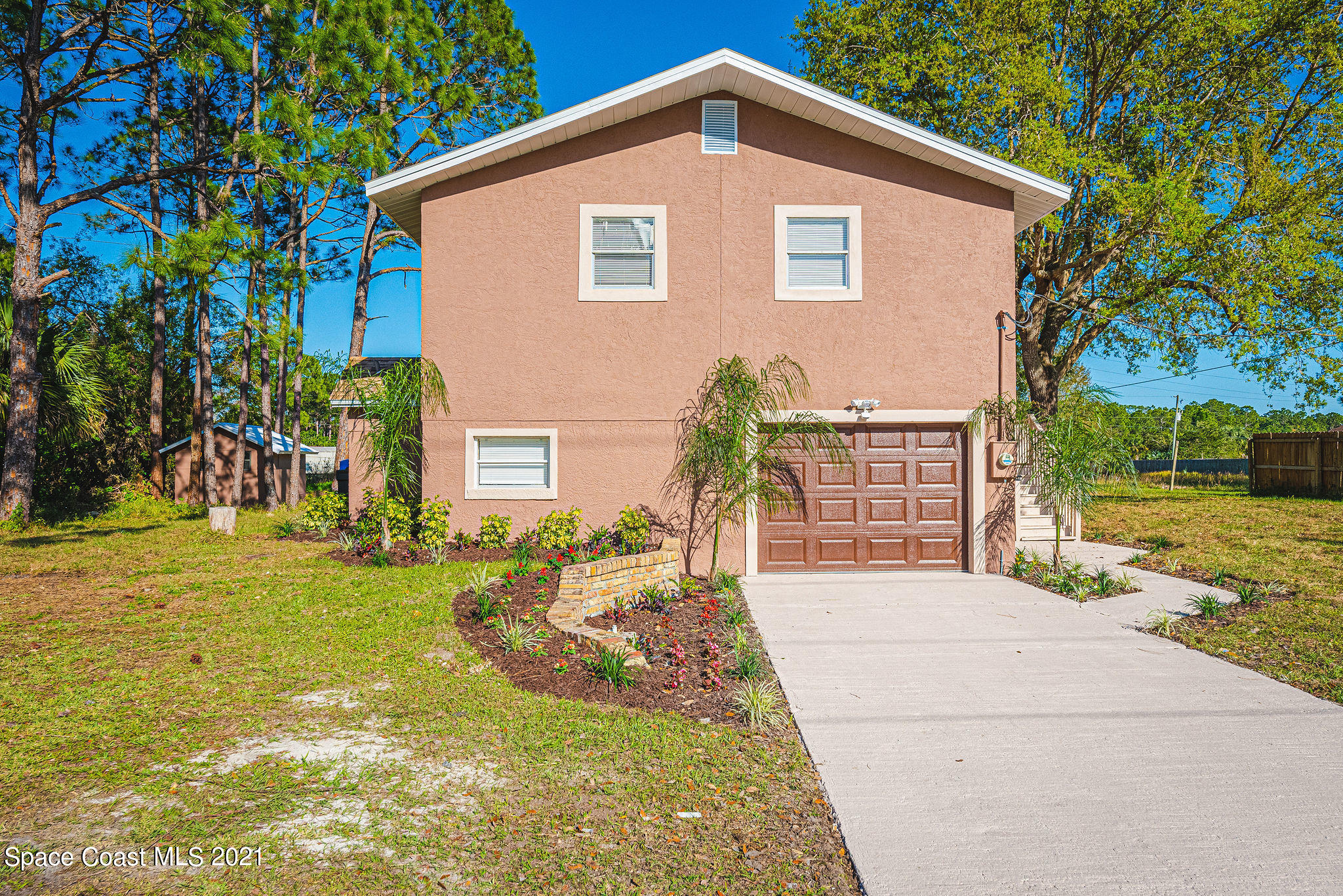 765 Garvey Road Palm Bay, FL 32908 - Photo 2 of 81 a view of a house with a yard