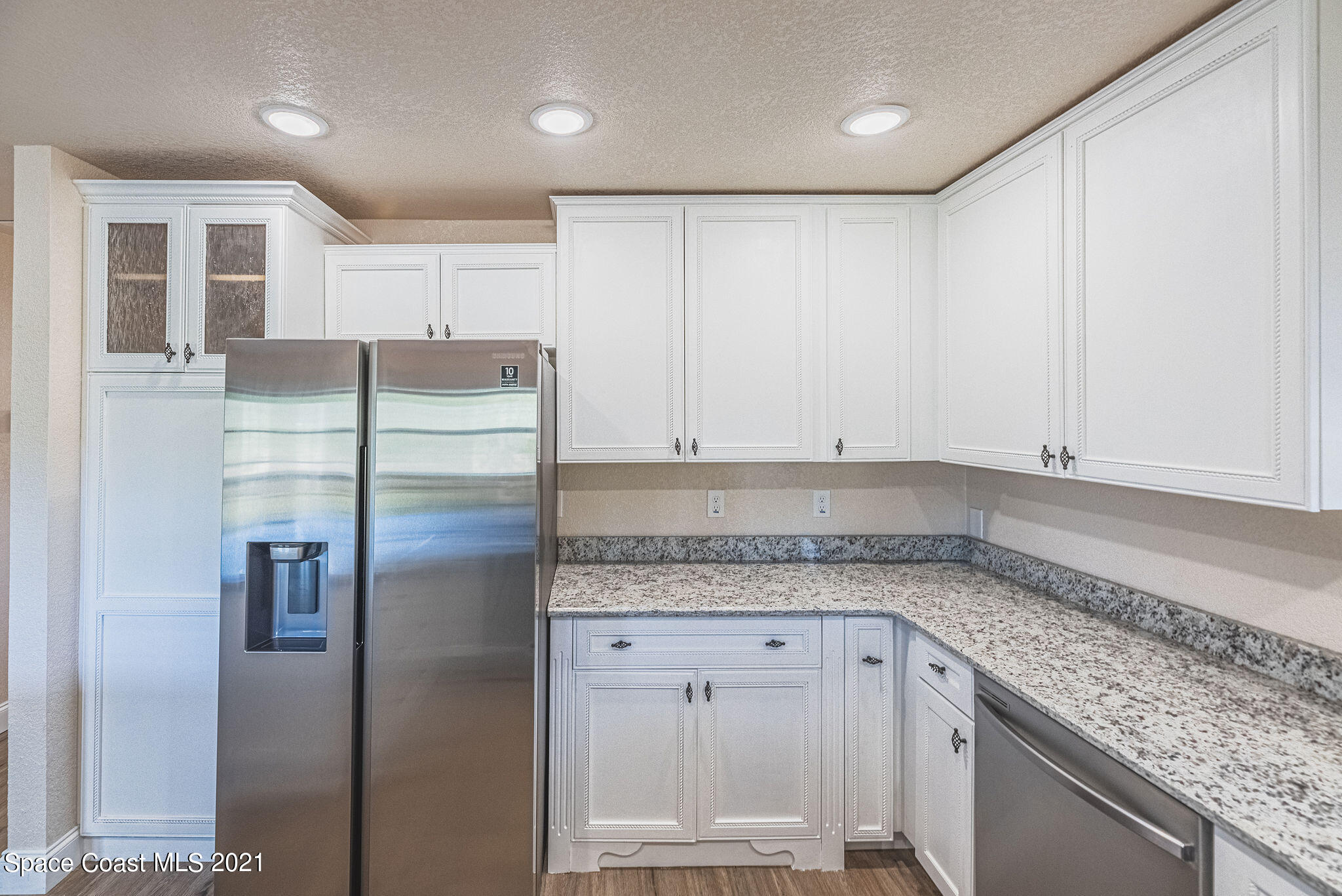 765 Garvey Road Palm Bay, FL 32908 - Photo 21 of 81 a kitchen with stainless steel appliances granite countertop a refrigerator and a sink