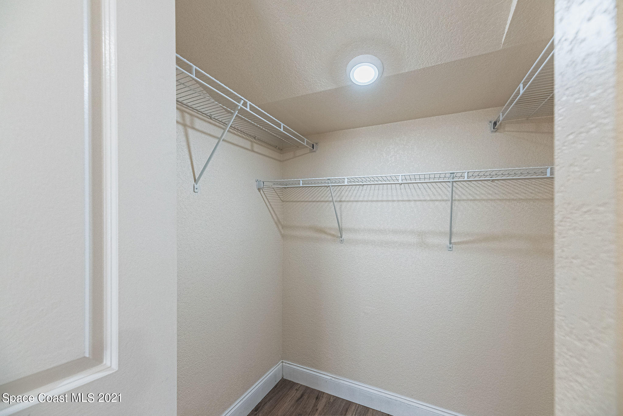 765 Garvey Road Palm Bay, FL 32908 - Photo 29 of 81 a view of a room with racks on the wall