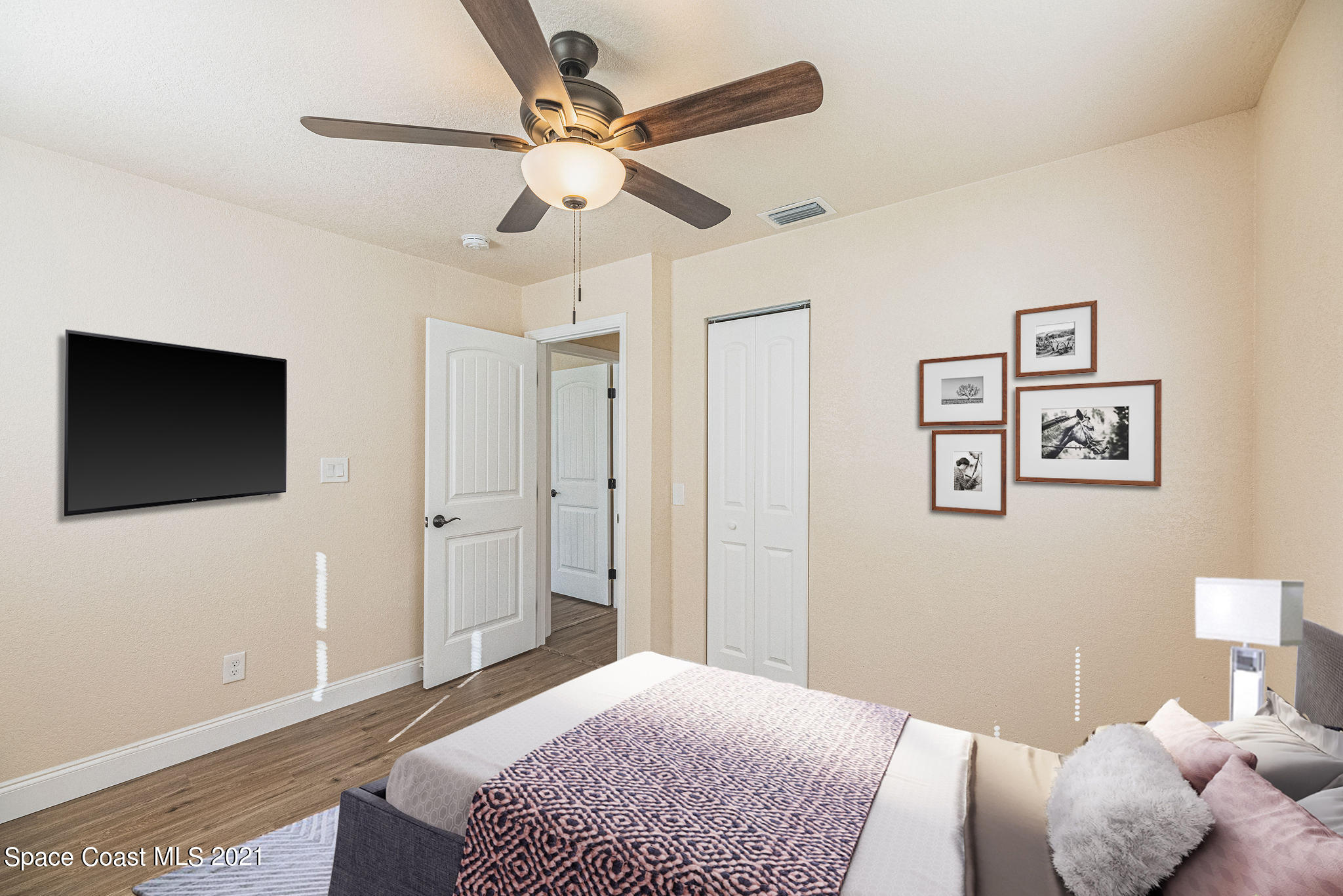 765 Garvey Road Palm Bay, FL 32908 - Photo 32 of 81 a bedroom with a bed and a flat screen tv
