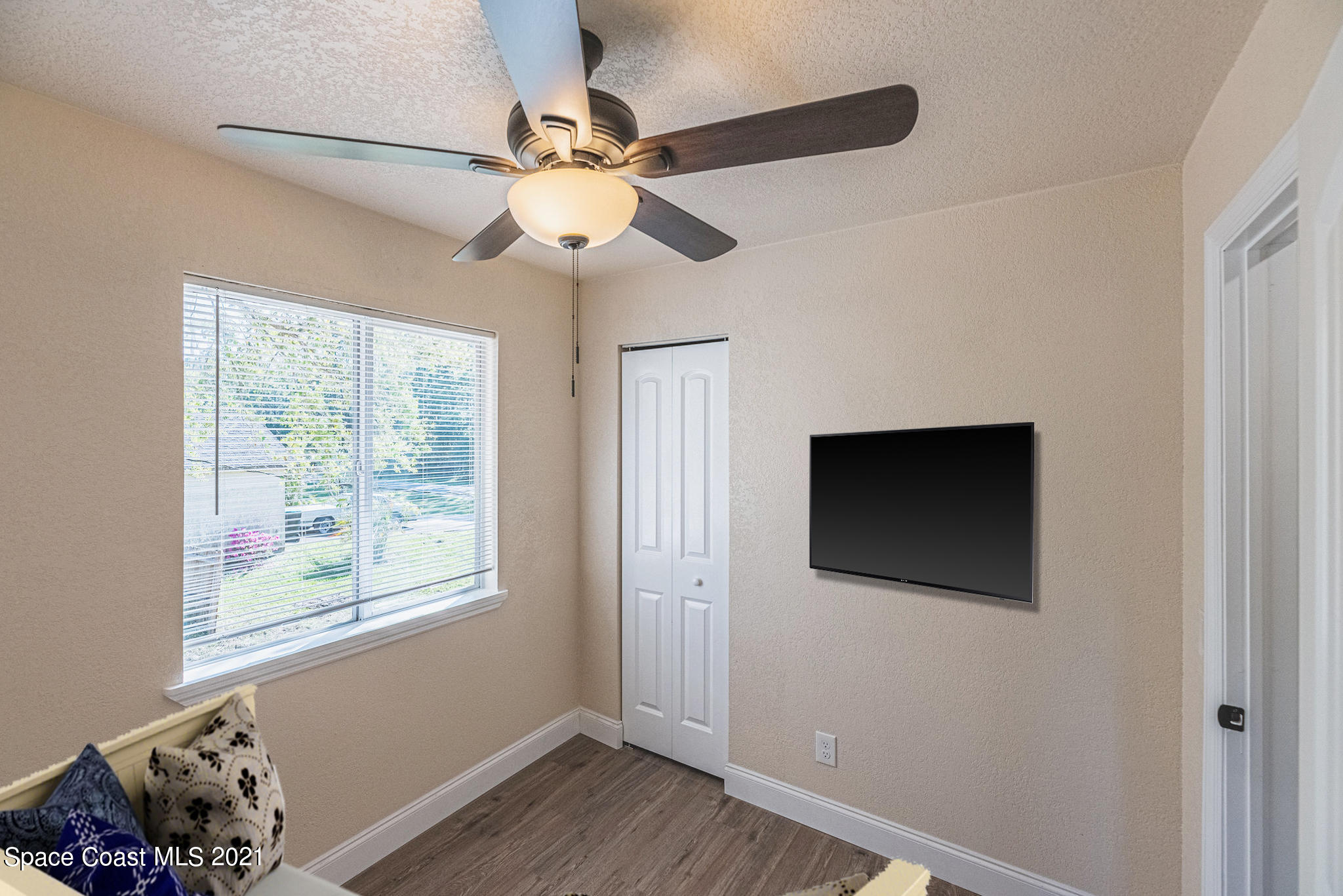 765 Garvey Road Palm Bay, FL 32908 - Photo 38 of 81 a view of a livingroom with furniture and chandelier fan