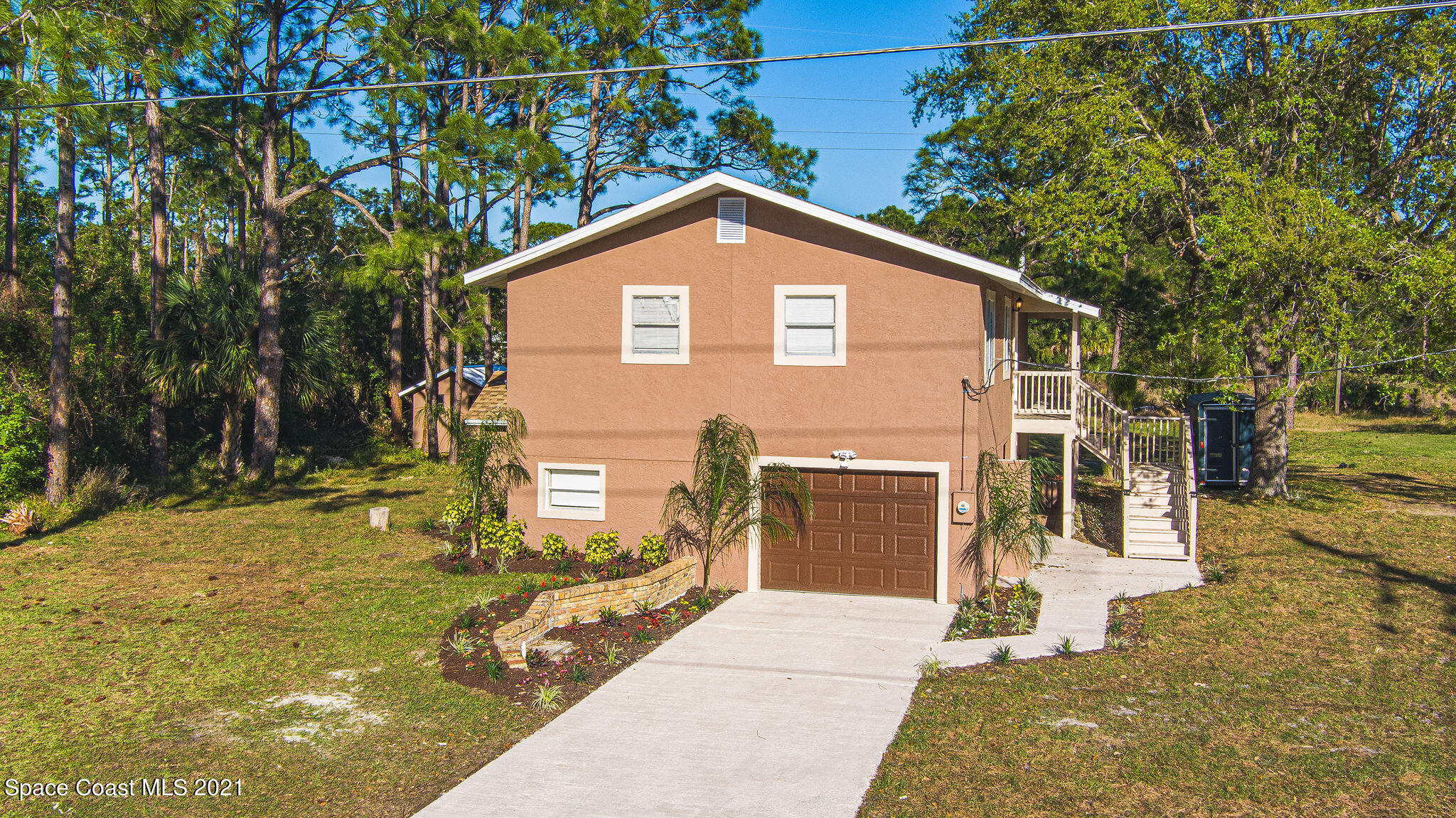 765 Garvey Road Palm Bay, FL 32908 - Photo 5 of 81 a view of a house with a yard