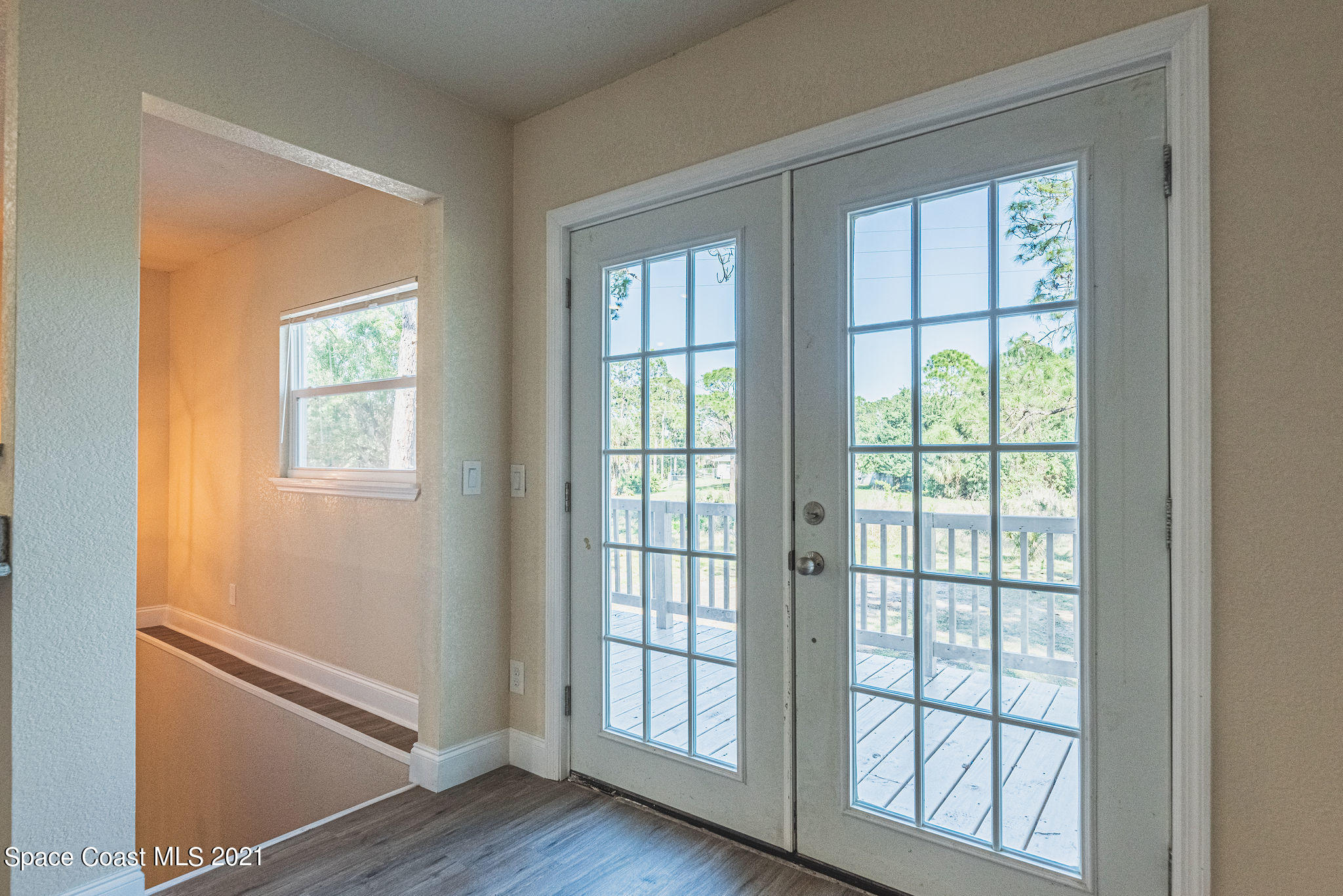765 Garvey Road Palm Bay, FL 32908 - Photo 42 of 81 a view of empty room with wooden floor and fan