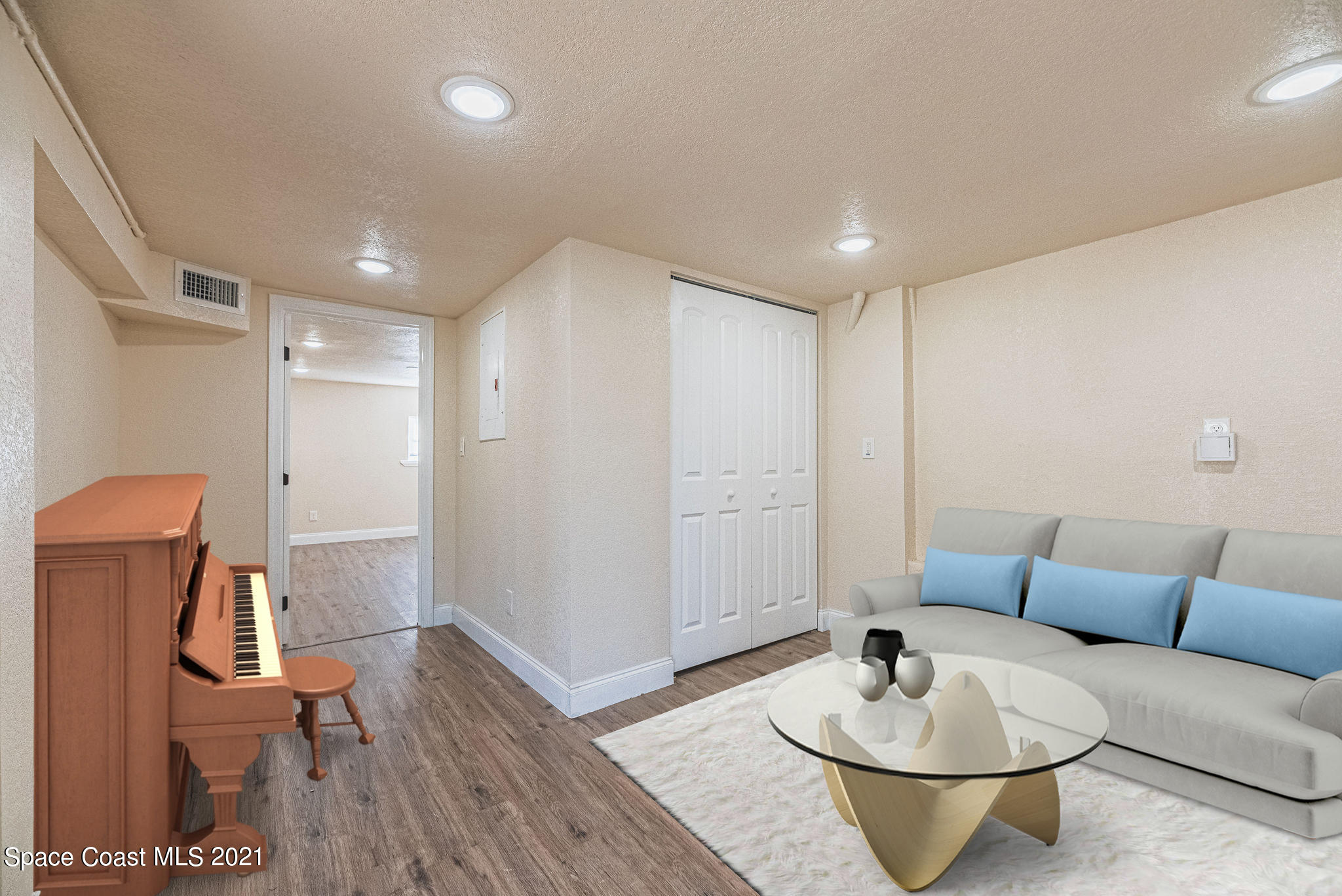 765 Garvey Road Palm Bay, FL 32908 - Photo 49 of 81 a living room with furniture and wooden floor
