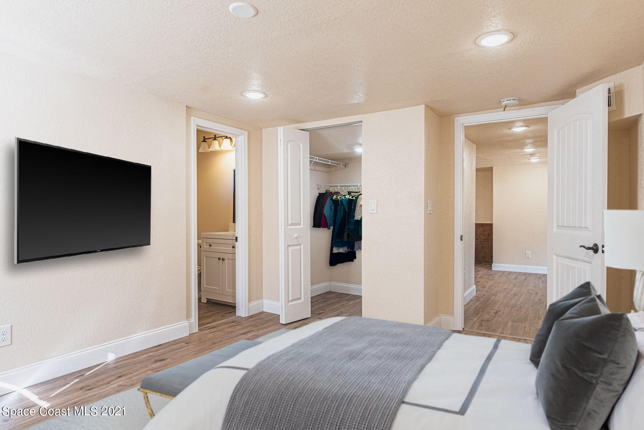 765 Garvey Road Palm Bay, FL 32908 - Photo 51 of 81 a bedroom with a bed and a flat screen tv