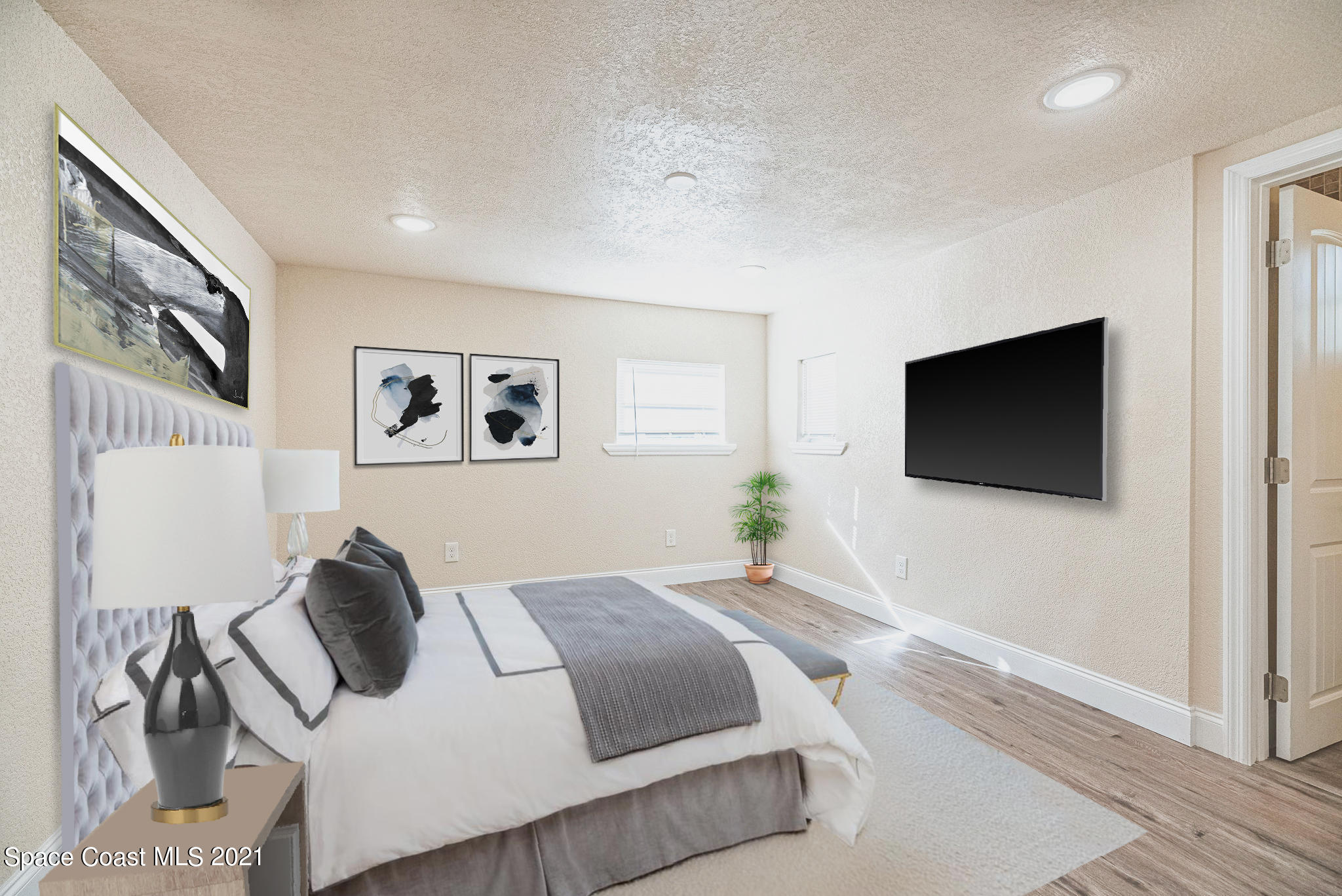 765 Garvey Road Palm Bay, FL 32908 - Photo 53 of 81 a bedroom with a bed and a flat screen tv