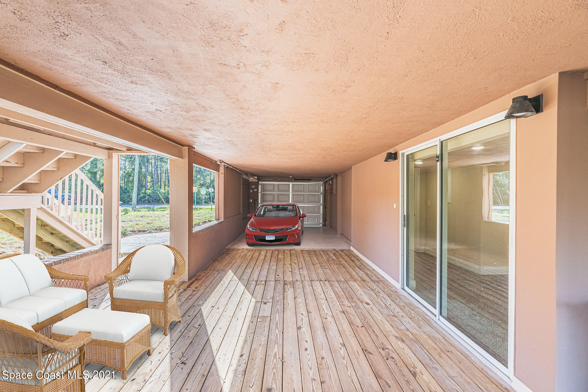 765 Garvey Road Palm Bay, FL 32908 - Photo 59 of 81 a view of a balcony with chair and wooden floor