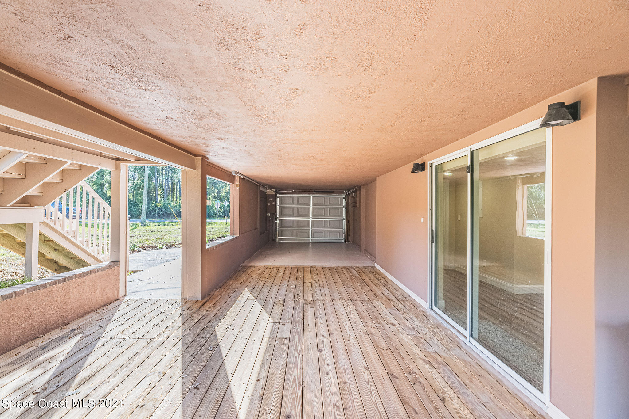 765 Garvey Road Palm Bay, FL 32908 - Photo 60 of 81 Downstairs Deck and Garage space