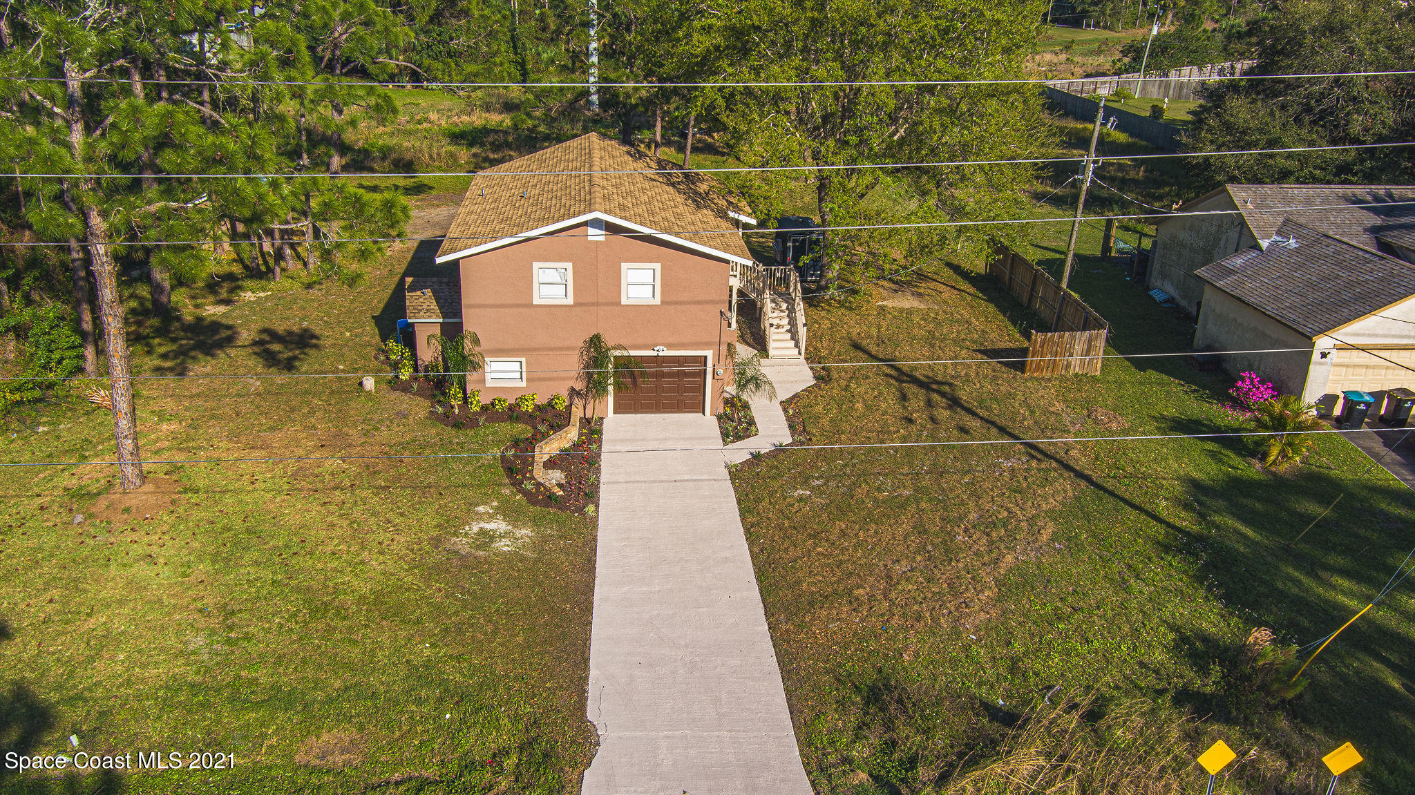 765 Garvey Road Palm Bay, FL 32908 - Photo 7 of 81 a view of a yard with an outdoor space