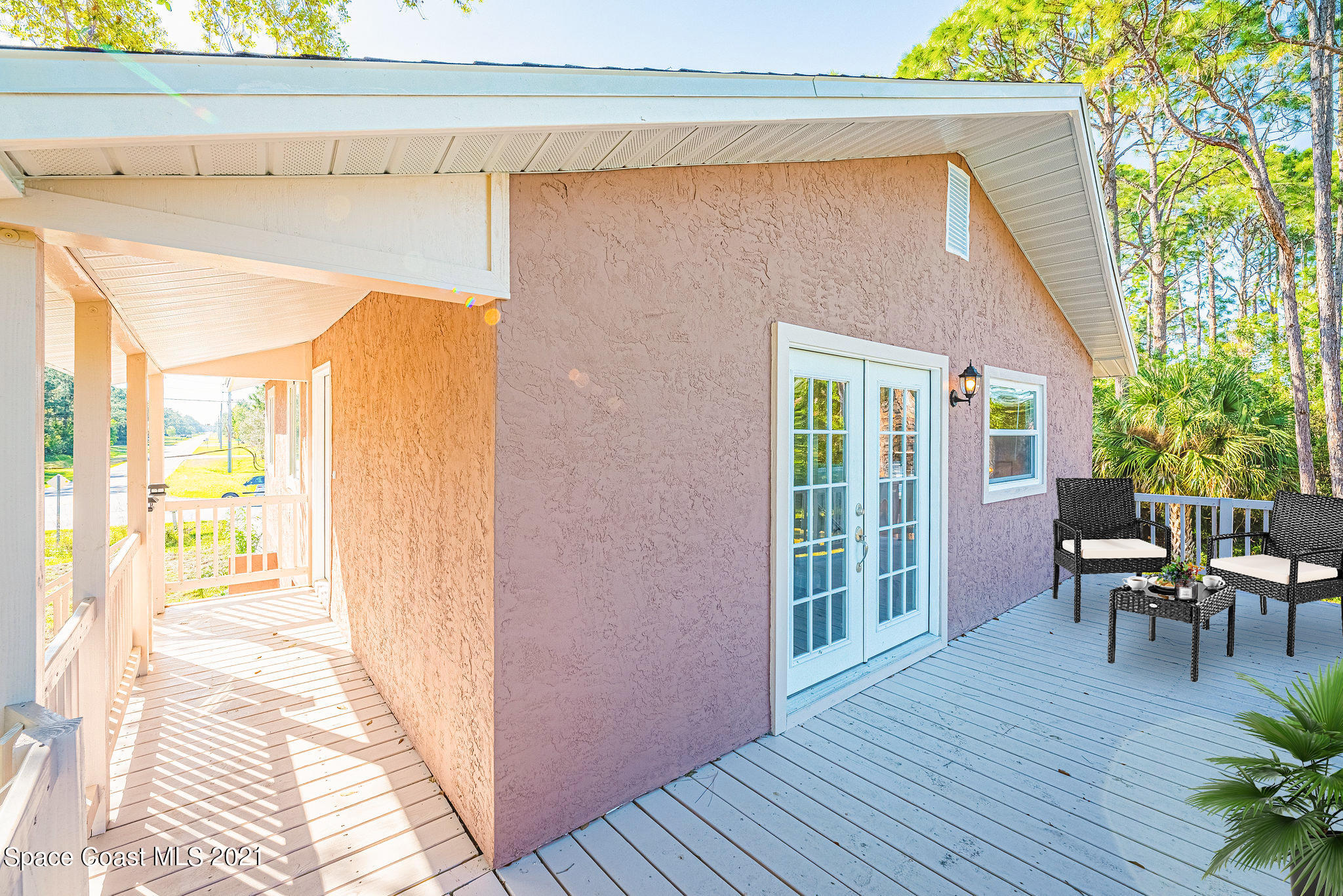 765 Garvey Road Palm Bay, FL 32908 - Photo 64 of 81 a balcony with furniture and wooden floor