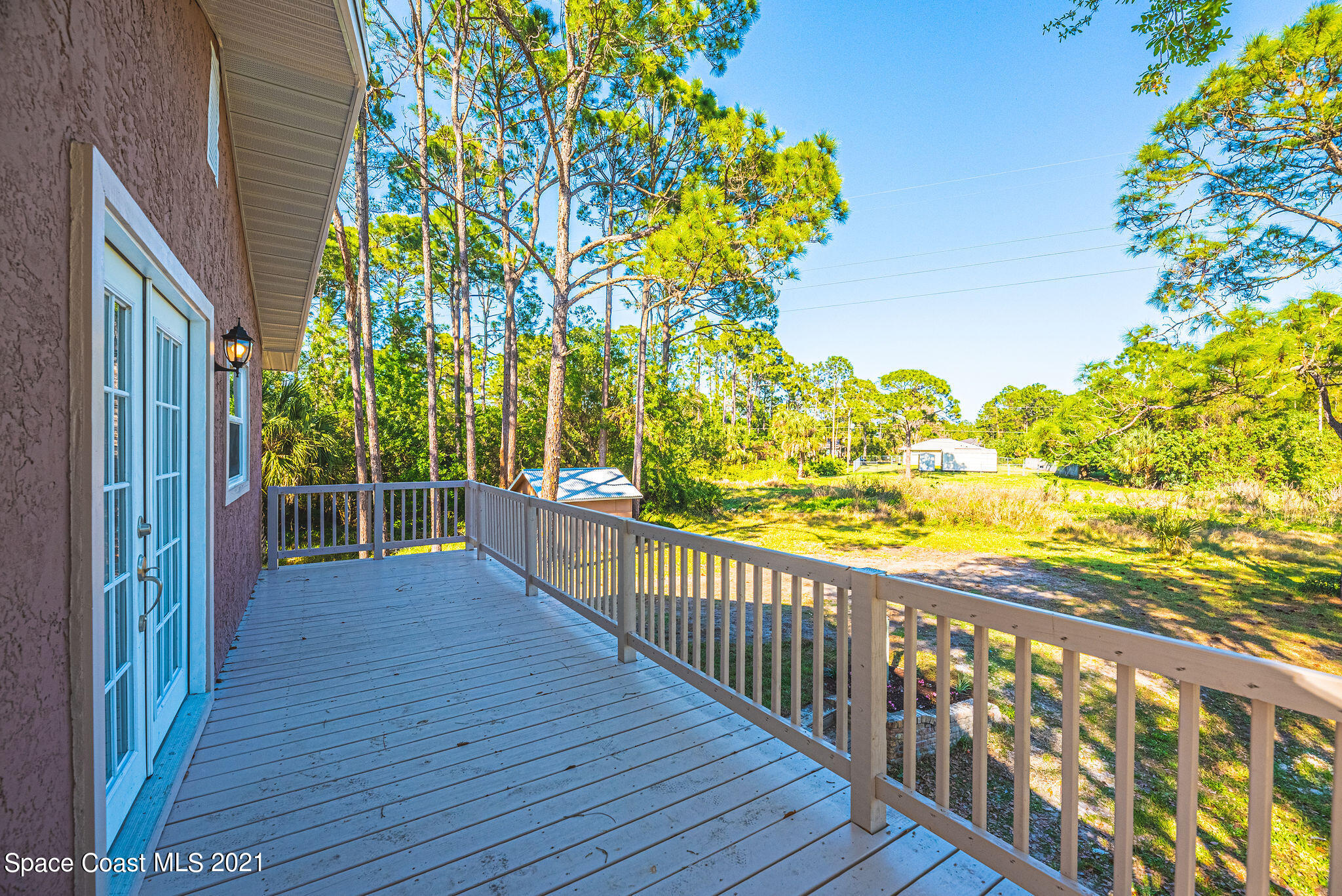 765 Garvey Road Palm Bay, FL 32908 - Photo 67 of 81 a view of a balcony with wooden floor