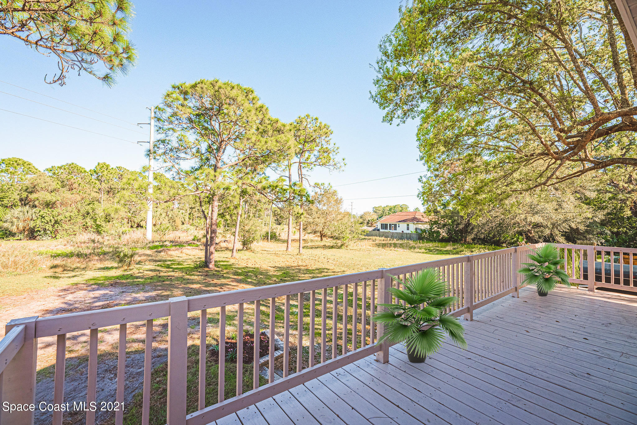 765 Garvey Road Palm Bay, FL 32908 - Photo 68 of 81 a view of a balcony with wooden floor space and outdoor space