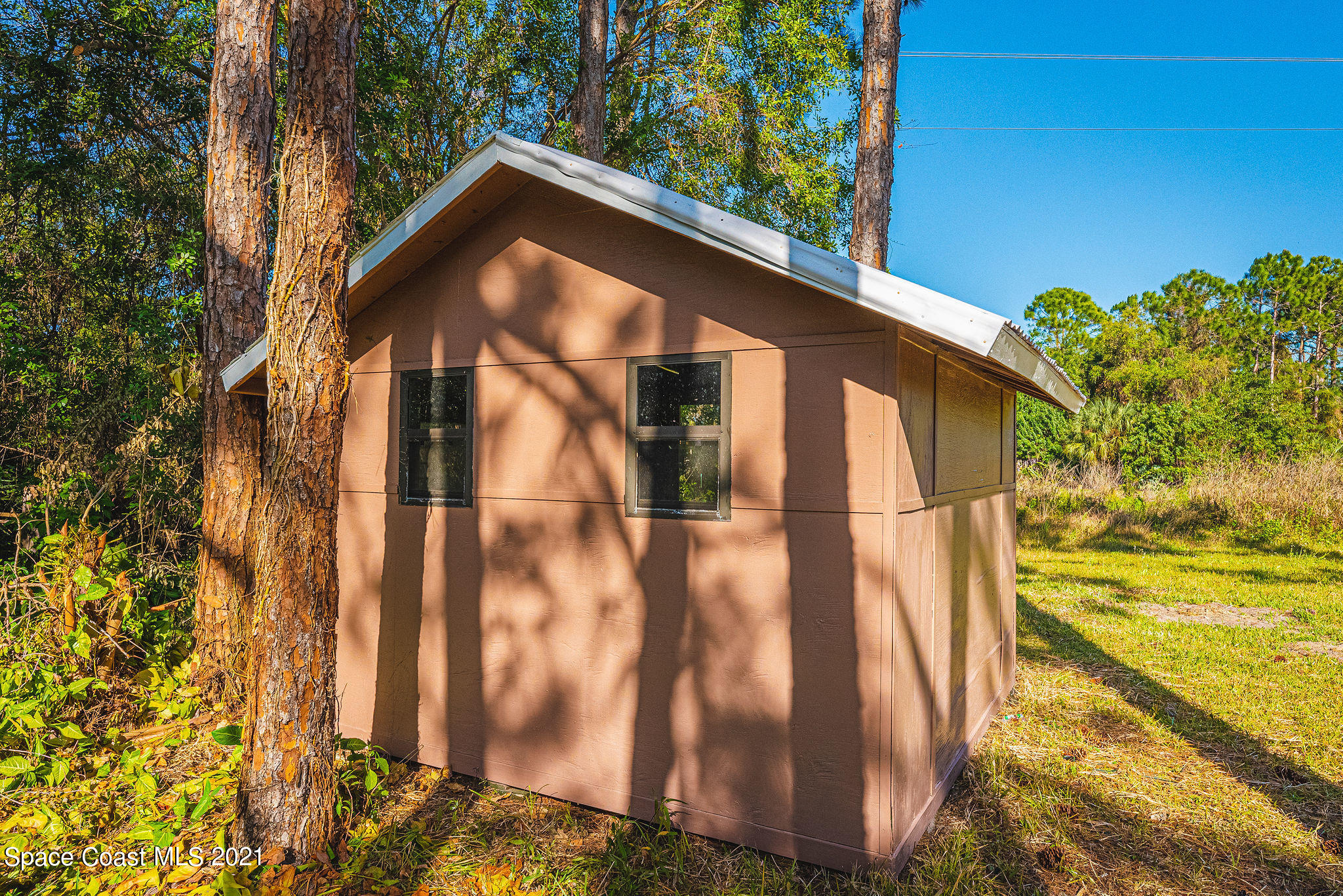 765 Garvey Road Palm Bay, FL 32908 - Photo 77 of 81 a view of a house with a yard