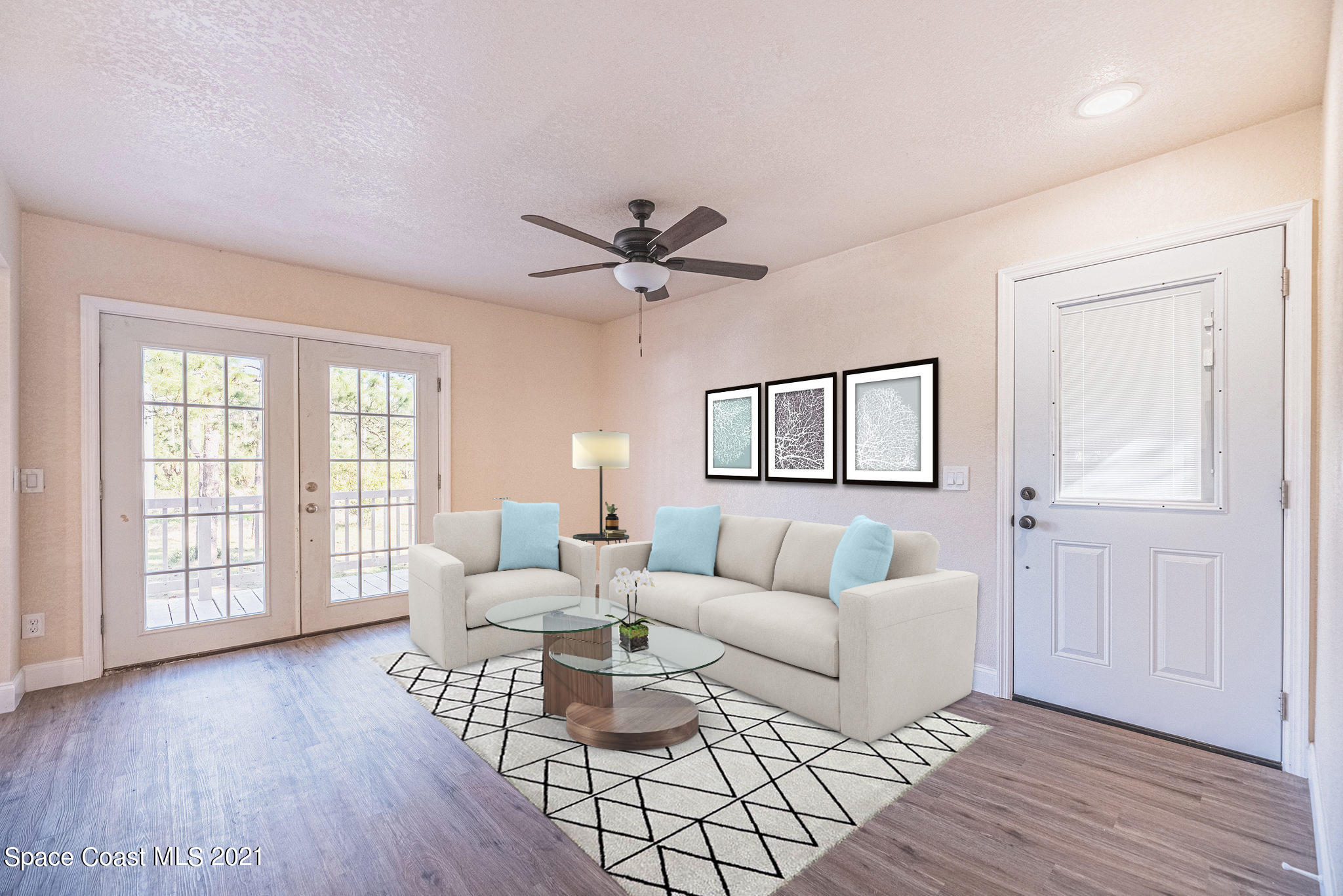 765 Garvey Road Palm Bay, FL 32908 - Photo 10 of 81 a living room with furniture and a window with wooden floor