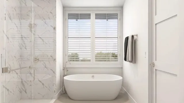 a spacious bathroom with a double vanity sink a mirror and a bathtub