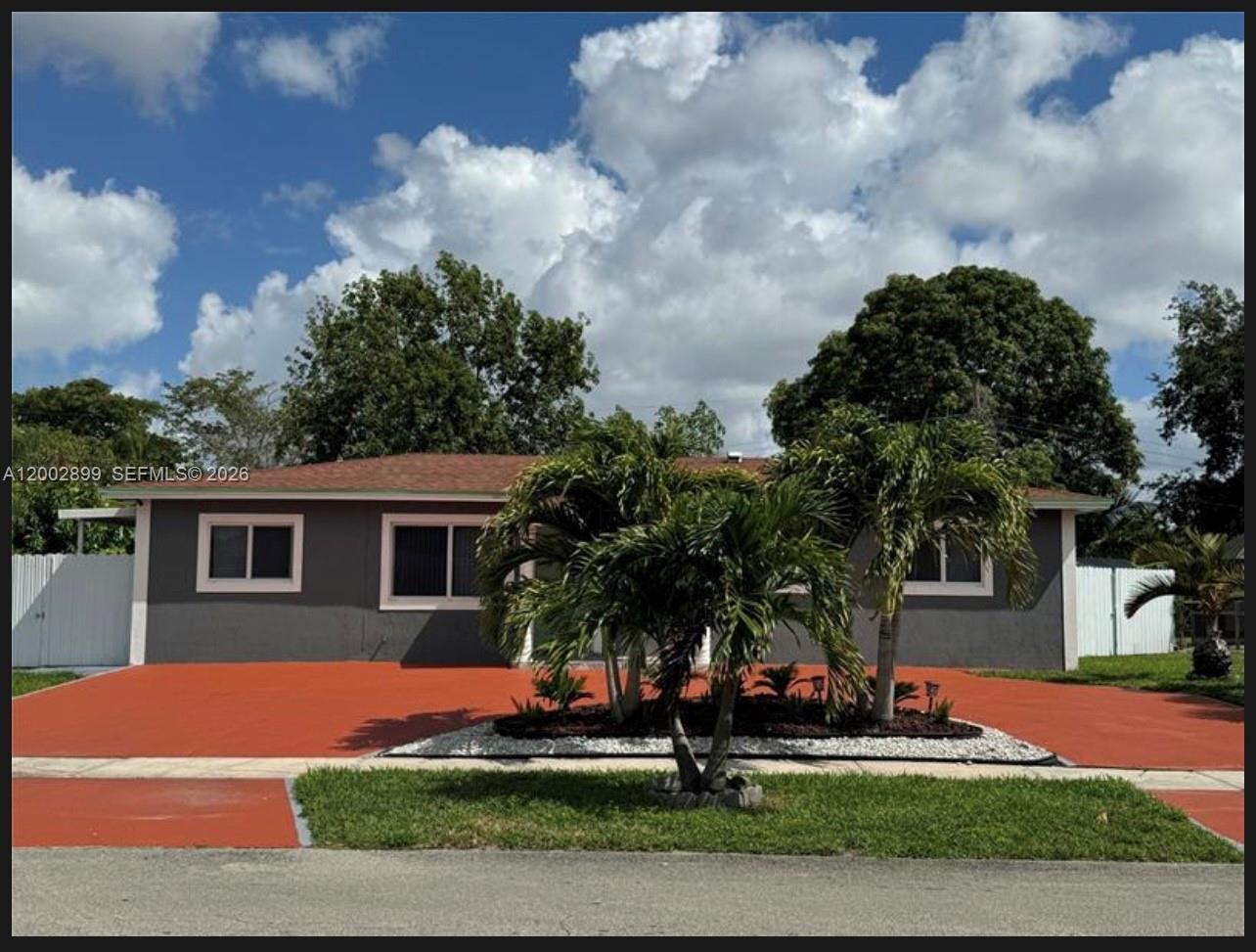 6471 Southwest 27th Street, Unit 1 & 2 Miramar, FL 33023 - Photo 1 of 29 a front view of a house with a yard