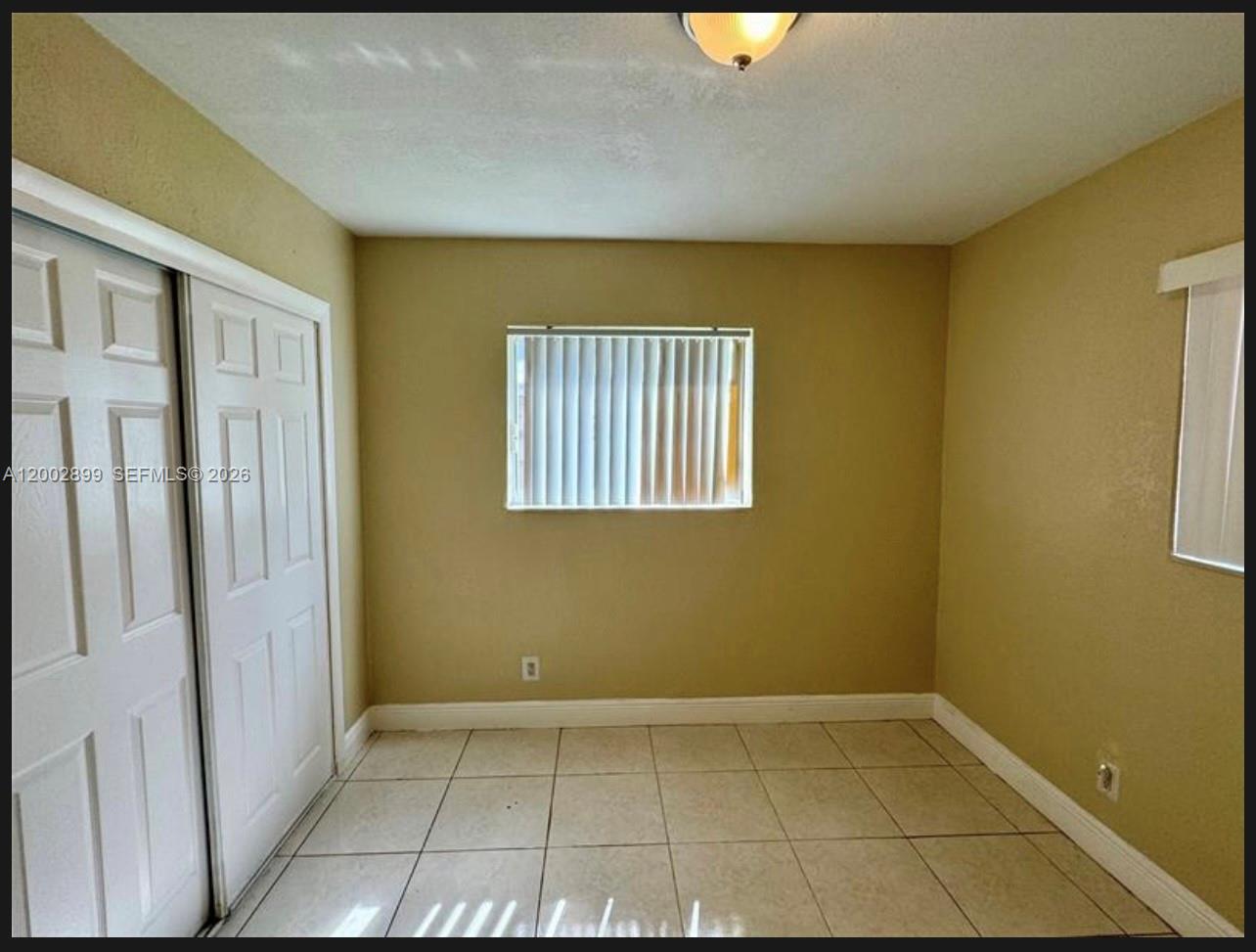 6471 Southwest 27th Street, Unit 1 & 2 Miramar, FL 33023 - Photo 14 of 29 a view of an empty room with a window