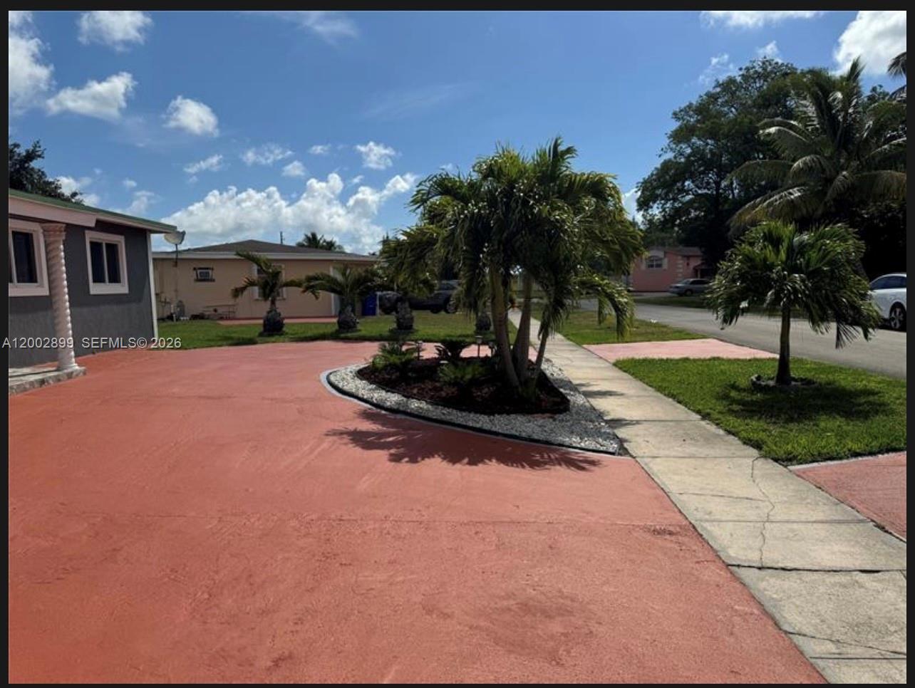 6471 Southwest 27th Street, Unit 1 & 2 Miramar, FL 33023 - Photo 2 of 29 a view of a backyard with a patio