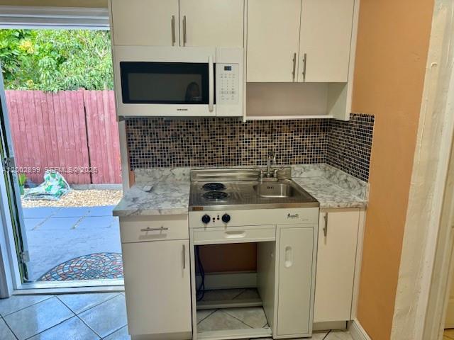 6471 Southwest 27th Street, Unit 1 & 2 Miramar, FL 33023 - Photo 21 of 29 a kitchen with a stove and a sink