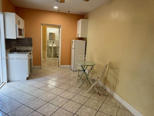 6471 Southwest 27th Street, Unit 1 & 2 Miramar, FL 33023 - Photo 23 of 29 a kitchen with a sink and cabinets
