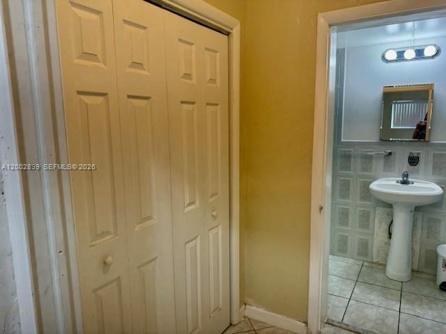 6471 Southwest 27th Street, Unit 1 & 2 Miramar, FL 33023 - Photo 24 of 29 a bathroom with a sink and mirror