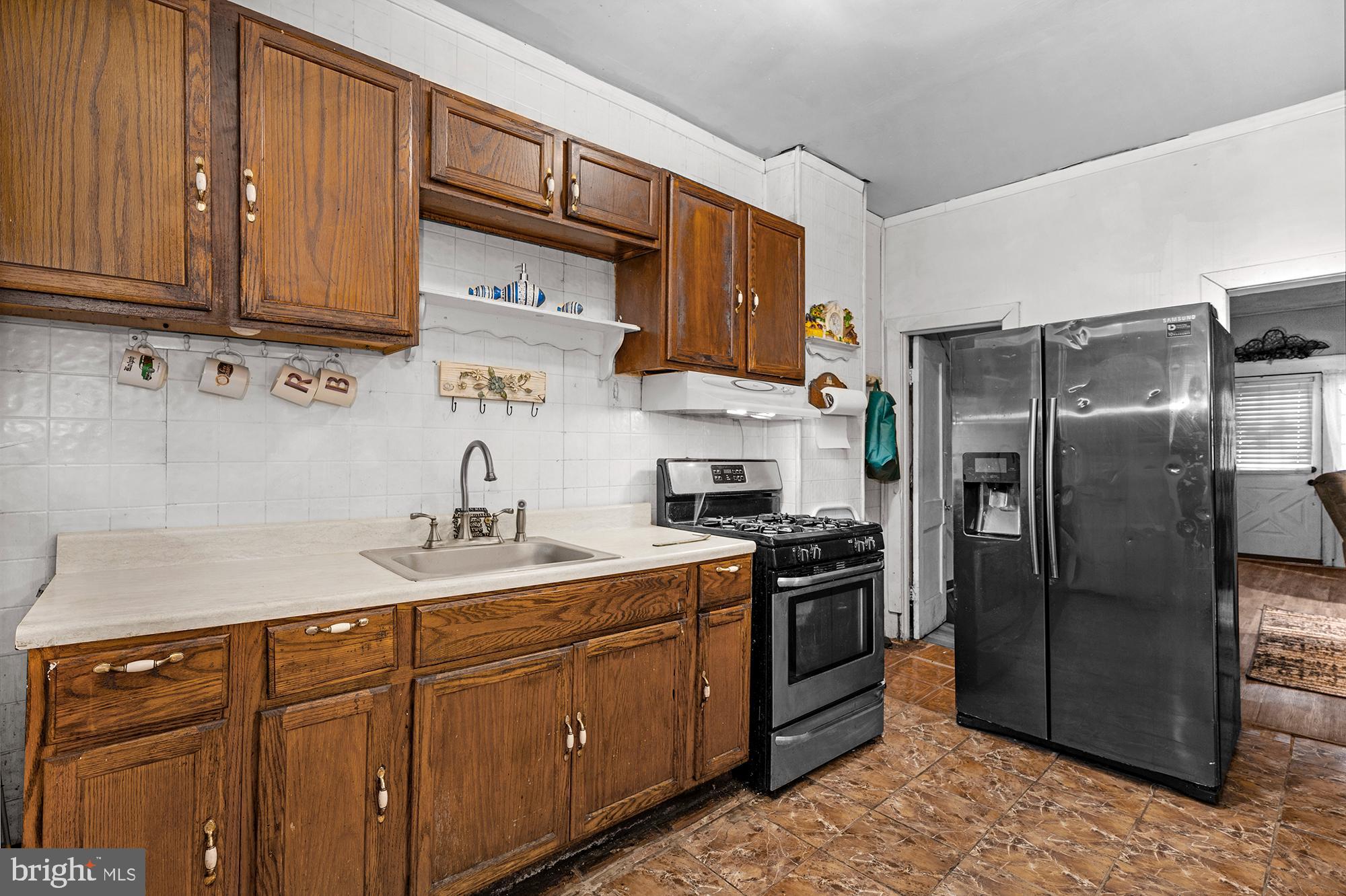 2410 Reisterstown Road Baltimore, MD 21217 - Photo 7 of 16 Kitchen w/ stainless steel appliances