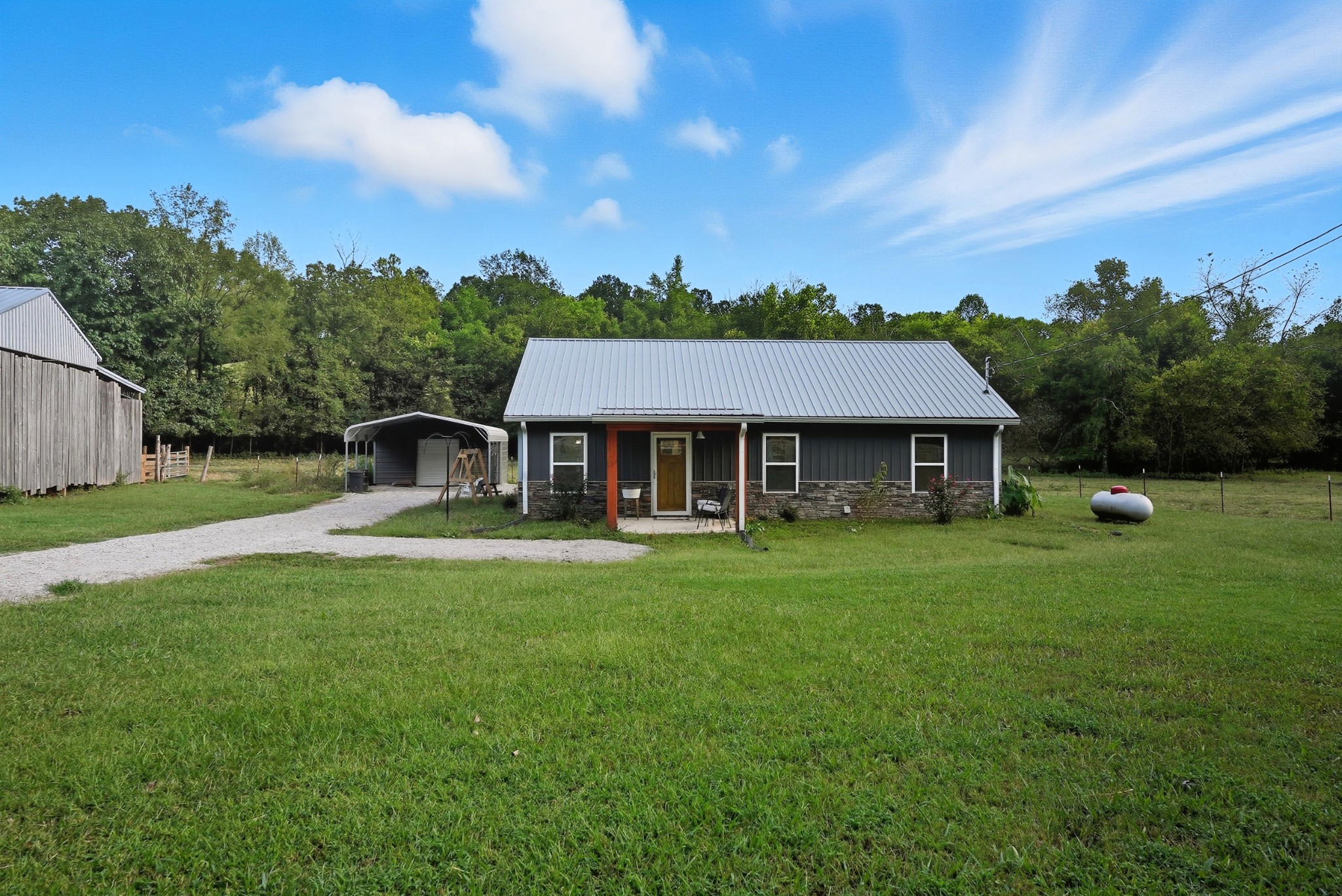 1215 Ennis Branch Road McEwen, TN 37101 - Photo 11 of 36 a front view of a house with garden