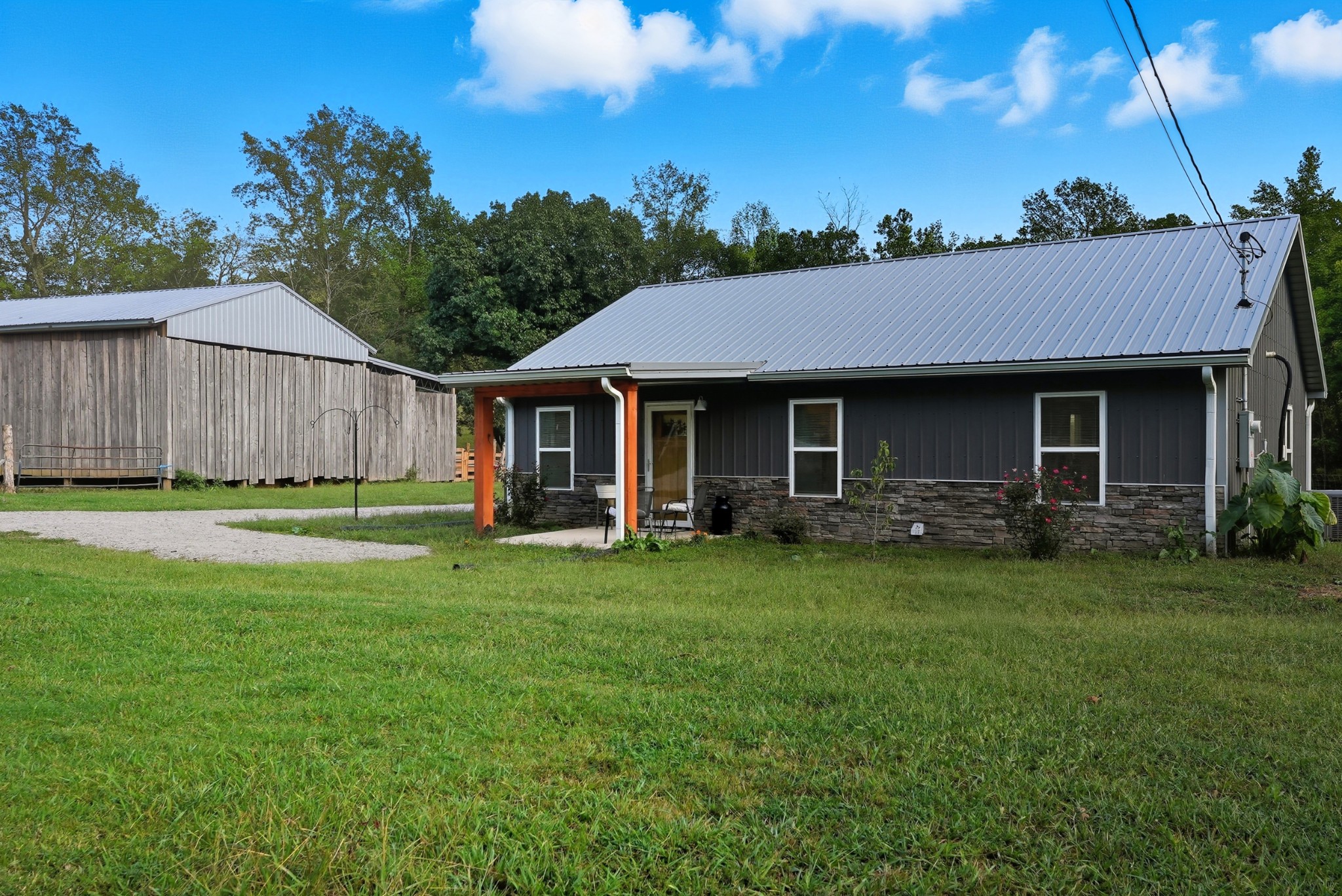 1215 Ennis Branch Road McEwen, TN 37101 - Photo 12 of 36 a front view of a house with a garden and porch