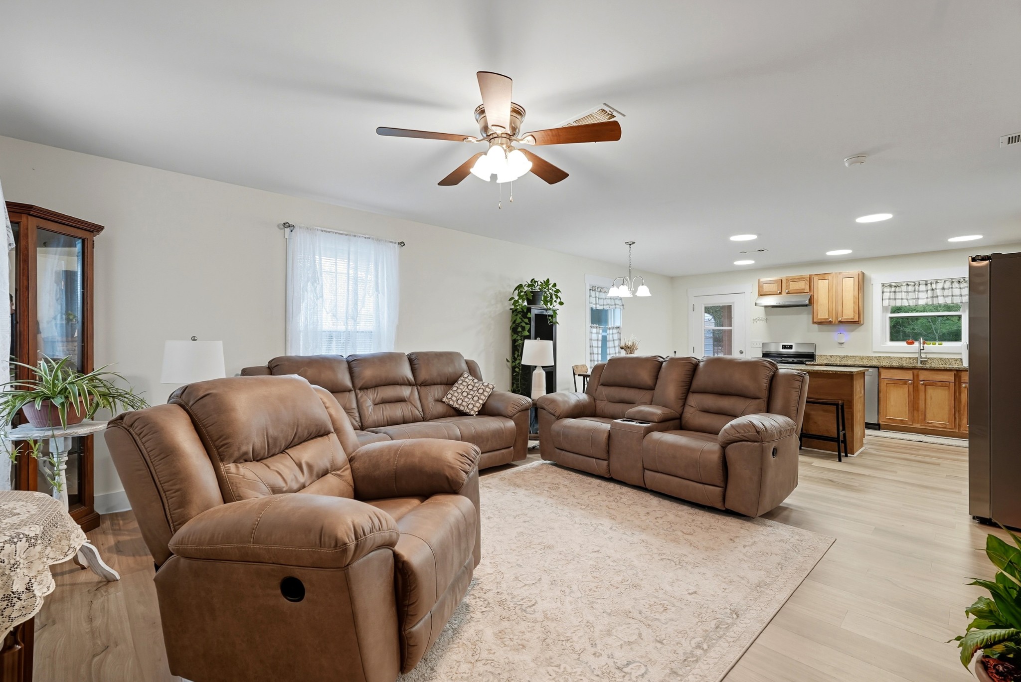 1215 Ennis Branch Road McEwen, TN 37101 - Photo 20 of 36 a living room with furniture kitchen view and a chandelier