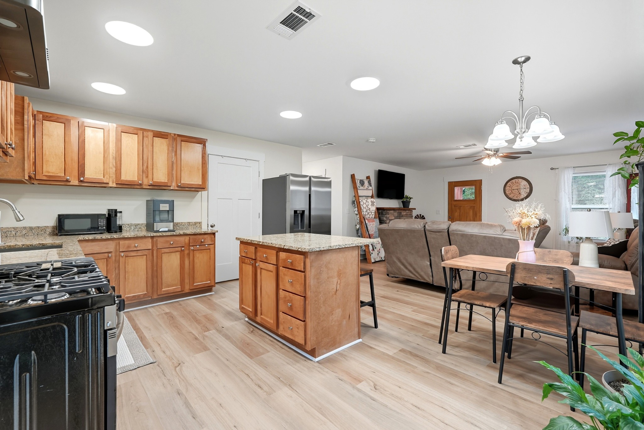 1215 Ennis Branch Road McEwen, TN 37101 - Photo 23 of 36 a kitchen that has a lot of cabinets a sink and a wooden floor