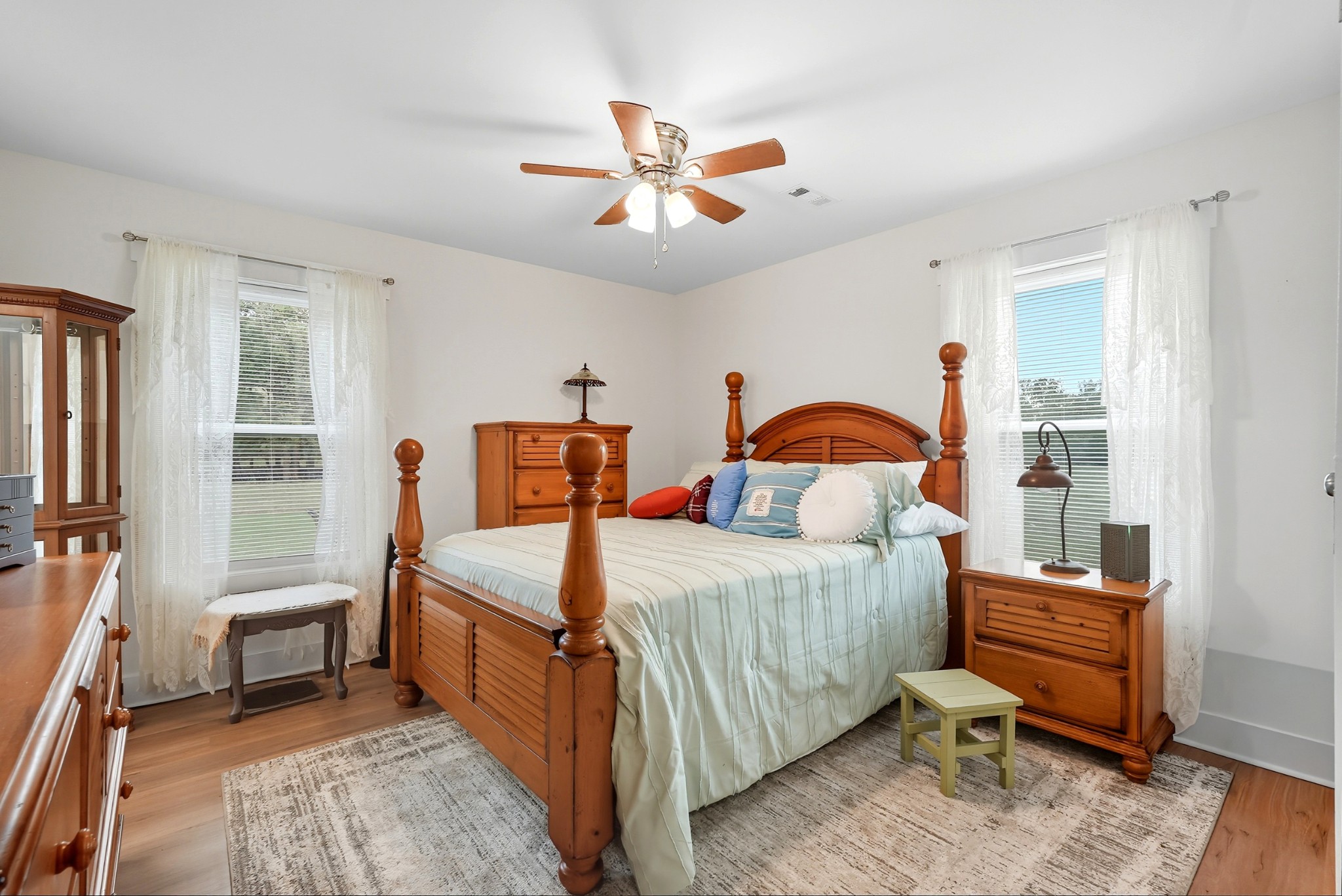 1215 Ennis Branch Road McEwen, TN 37101 - Photo 29 of 36 a bedroom with a bed and a chandelier