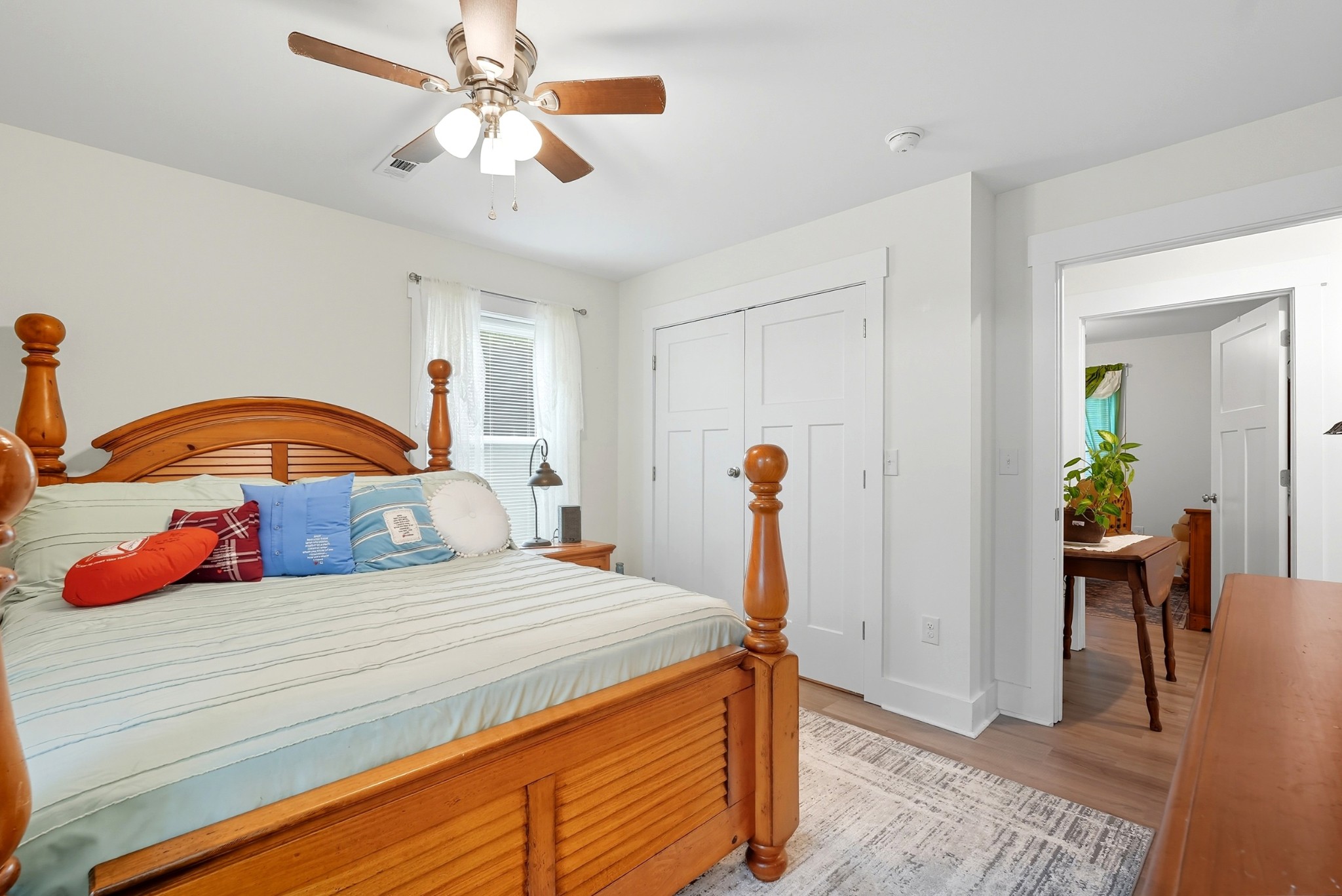 1215 Ennis Branch Road McEwen, TN 37101 - Photo 31 of 36 a bedroom with a bed and a chandelier