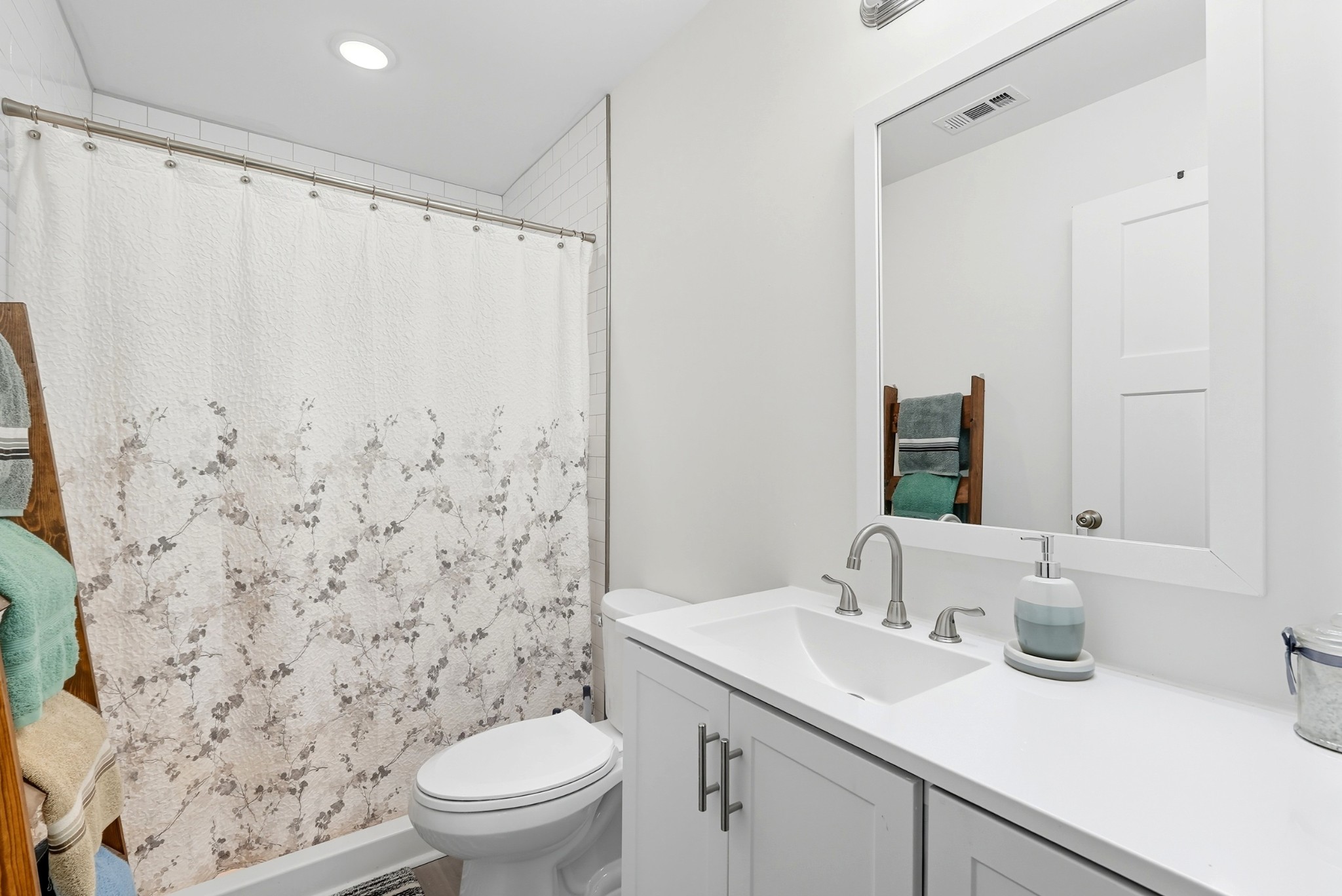 1215 Ennis Branch Road McEwen, TN 37101 - Photo 32 of 36 a bathroom with a sink toilet and shower