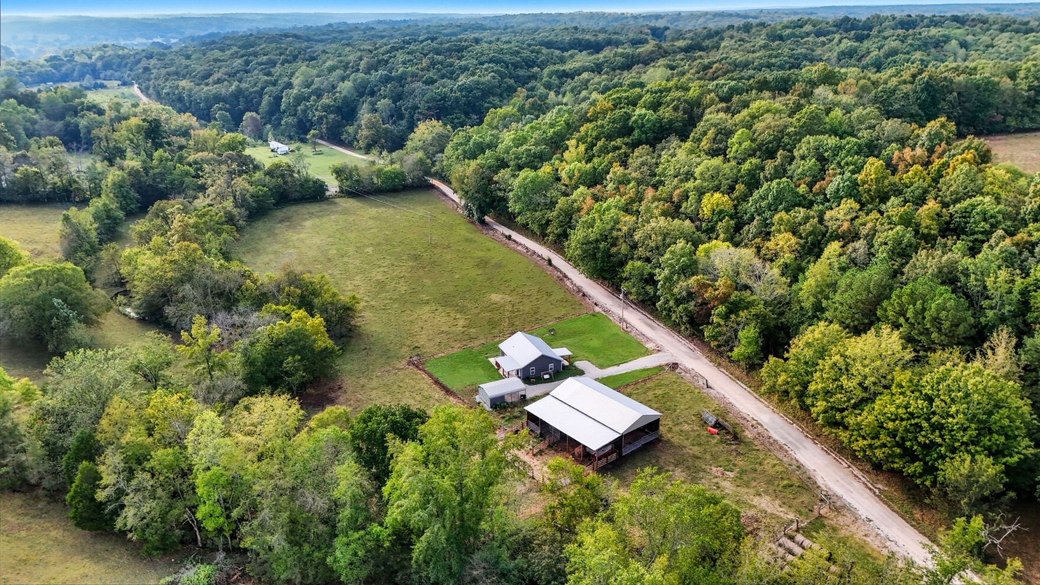 1215 Ennis Branch Road McEwen, TN 37101 - Photo 6 of 36 an aerial view of residential house with outdoor space and trees all around